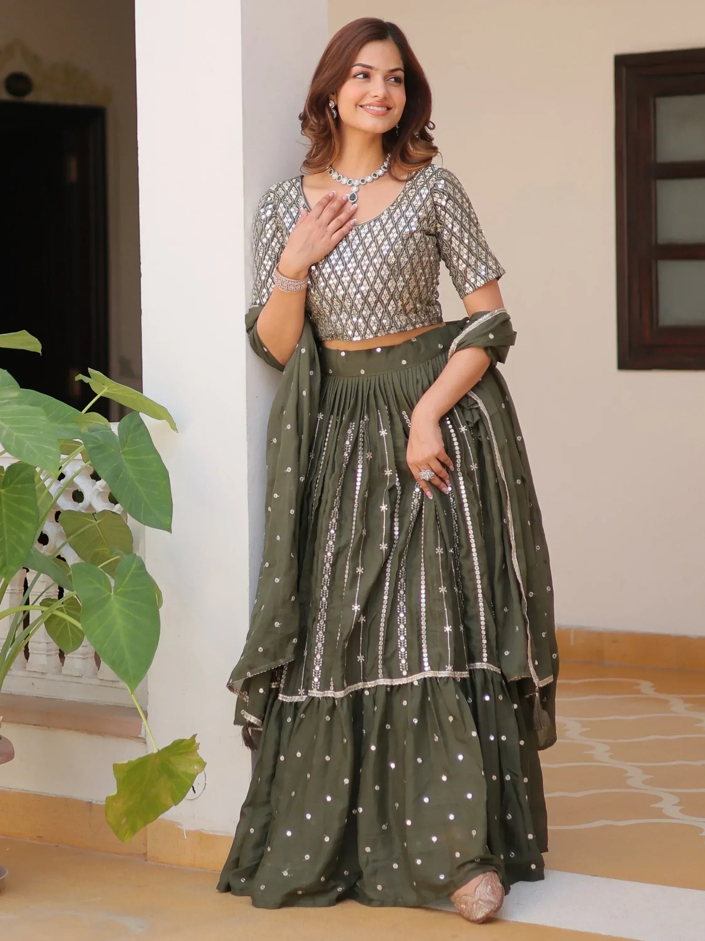 Olive green designer lehenga choli with mirror work and sequins, perfect for Indian ethnic wear occasions