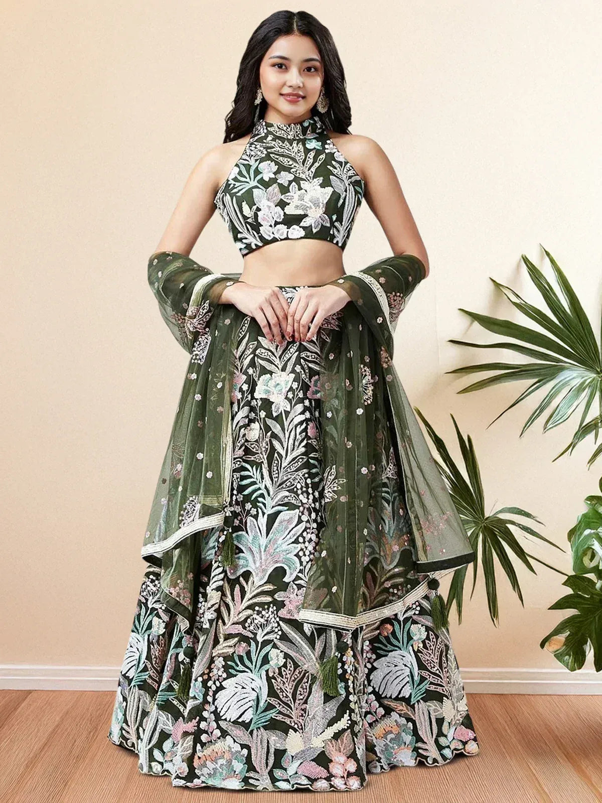 Green floral embroidered lehenga choli with halter neck blouse and sheer dupatta, perfect for Indian ethnic occasions