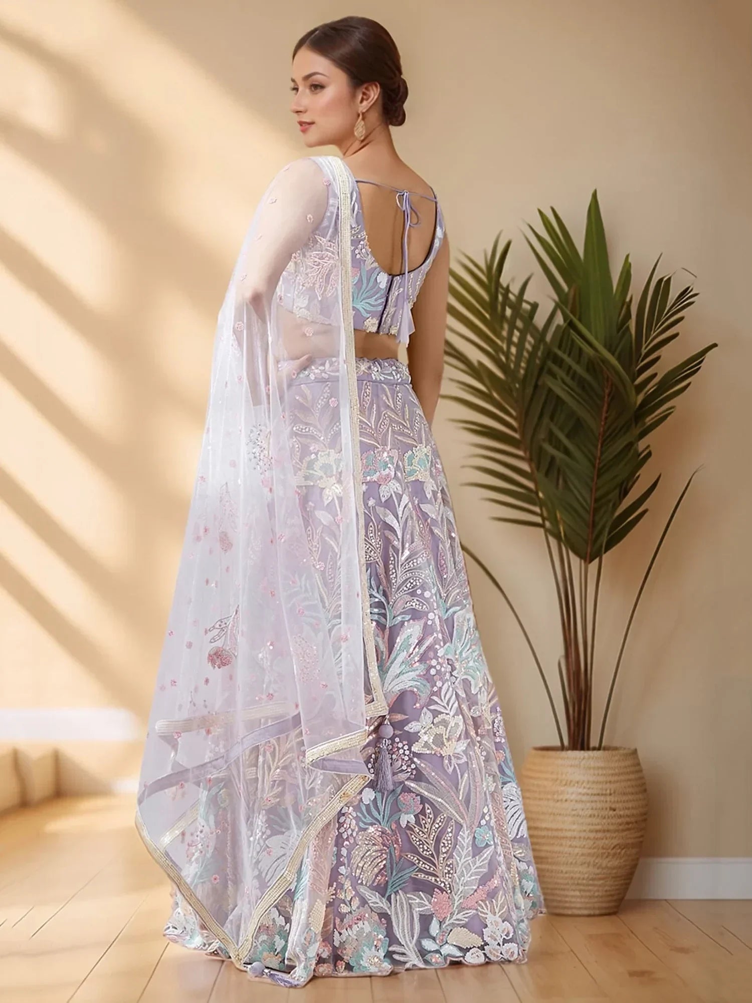 Elegant lavender lehenga choli with floral embroidery and sheer dupatta for Indian ethnic wear