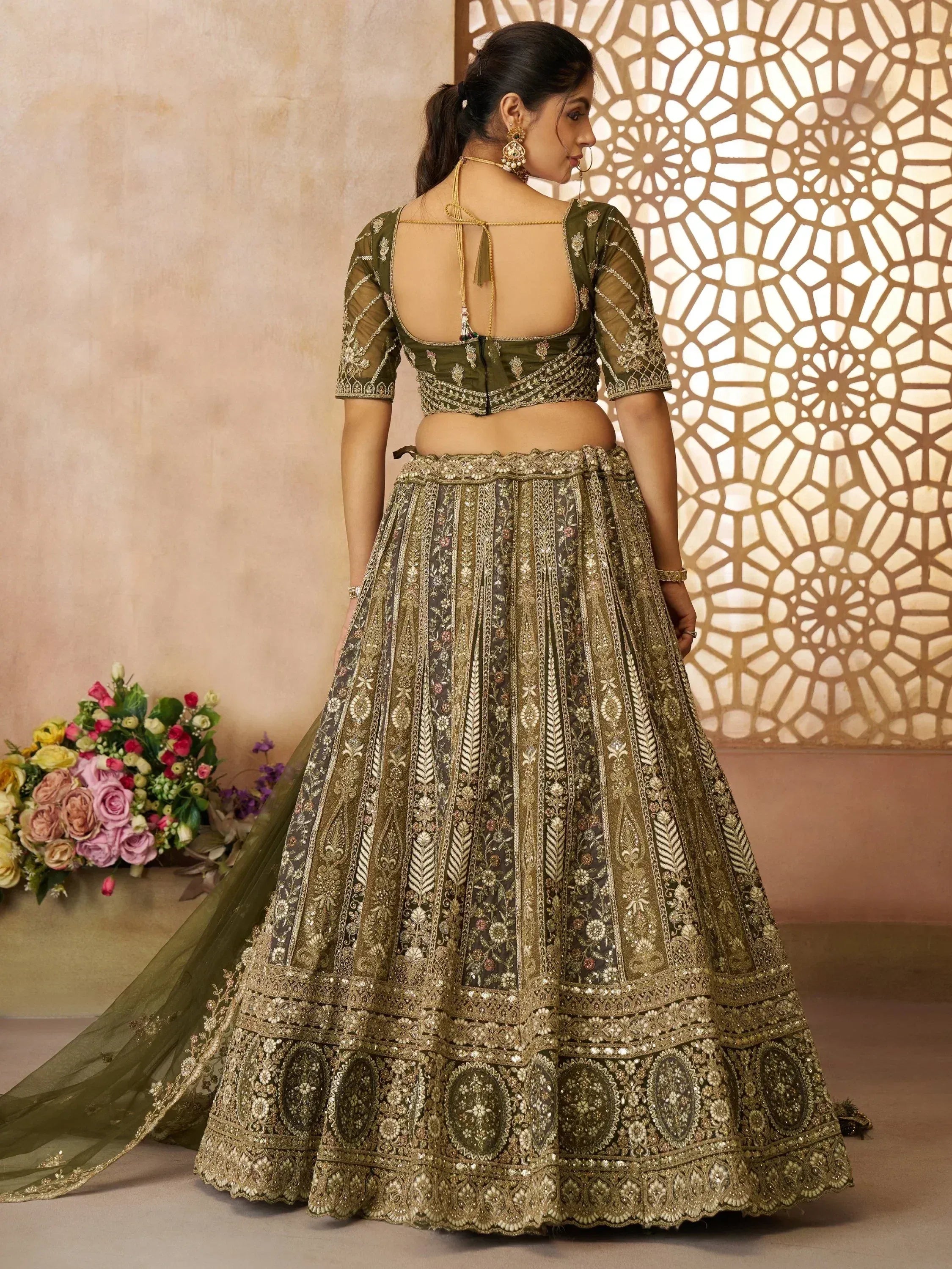 Olive green designer lehenga choli with heavy gold embroidery, back view, ethnic Indian wear