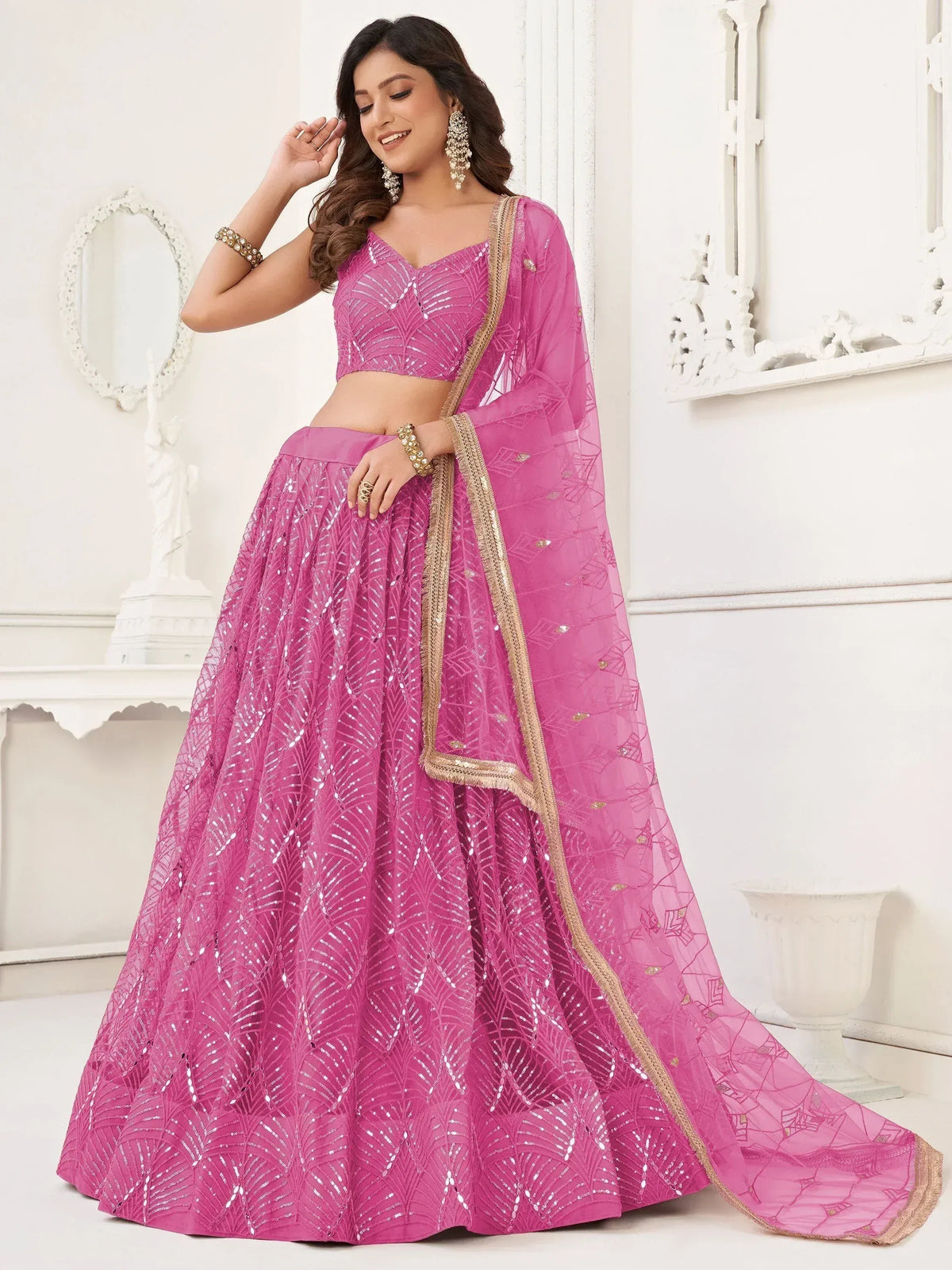 Pink sequin lehenga choli with gold trim, ethnic Indian wear for weddings and parties