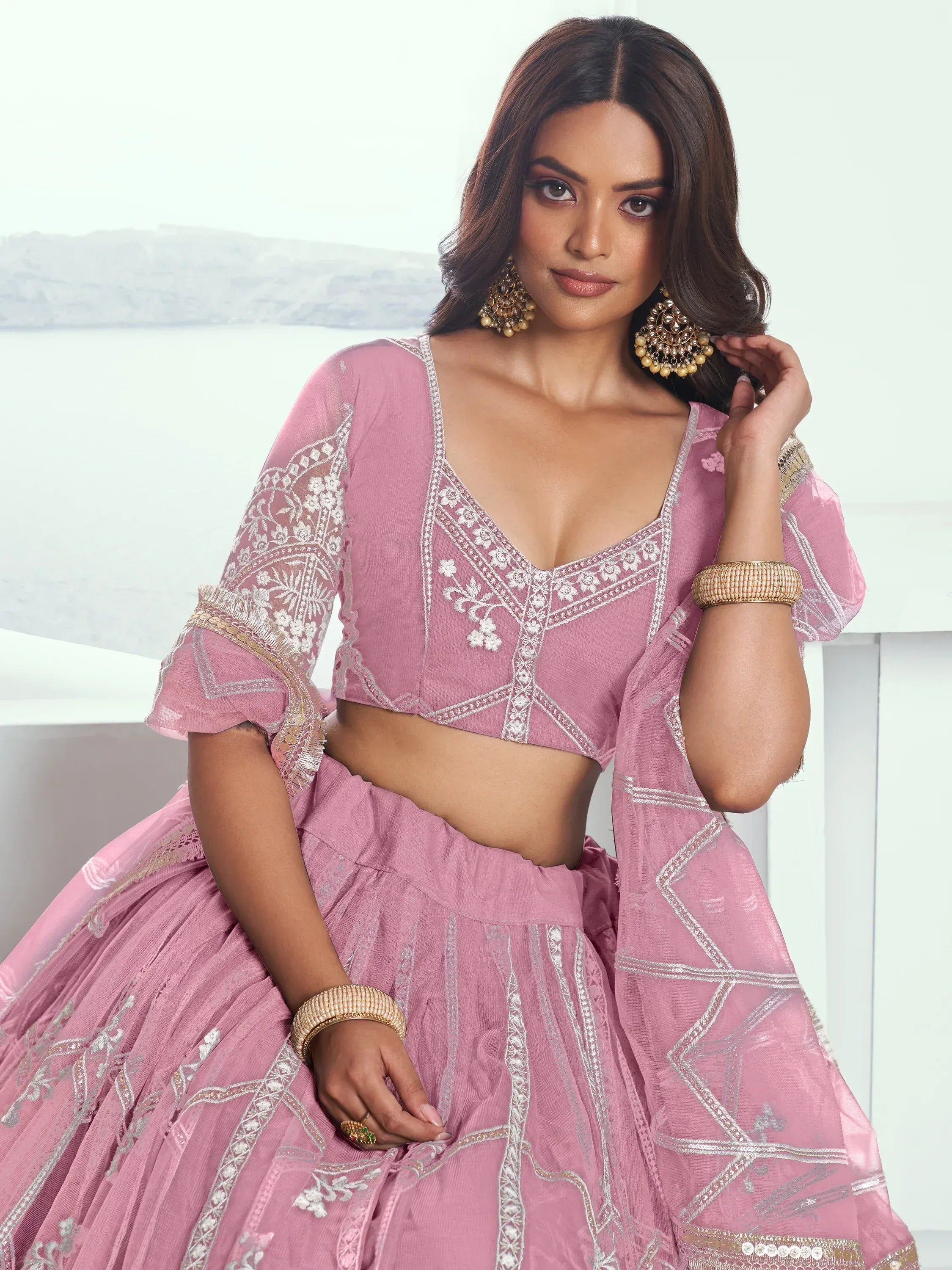 Pink embroidered lehenga choli with floral detailing, perfect for Indian ethnic wear and festive occasions.