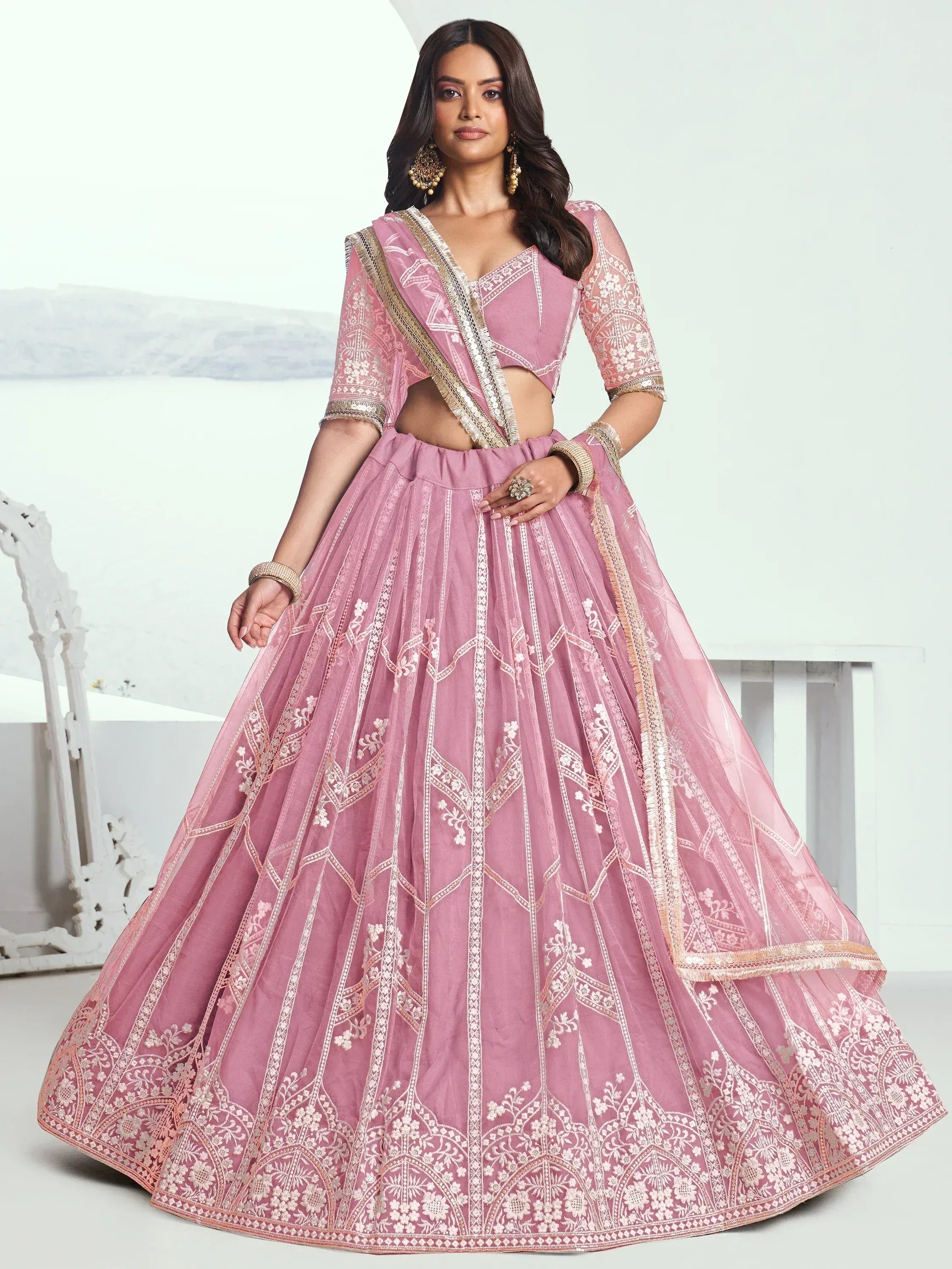 Pink embroidered lehenga choli with gold detailing, perfect for Indian ethnic wear events