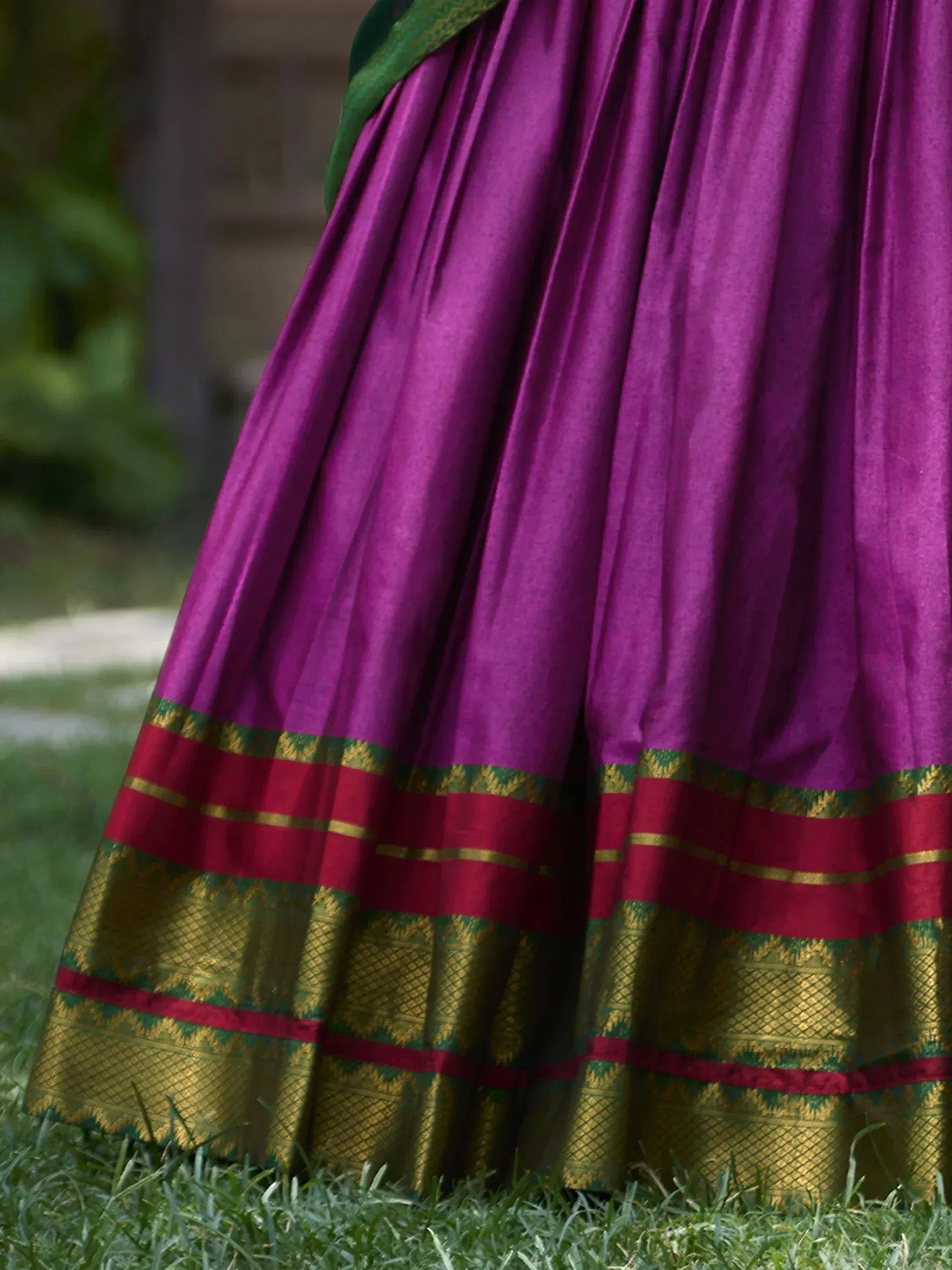 Purple silk lehenga with gold and red border, traditional Indian ethnic wear for women