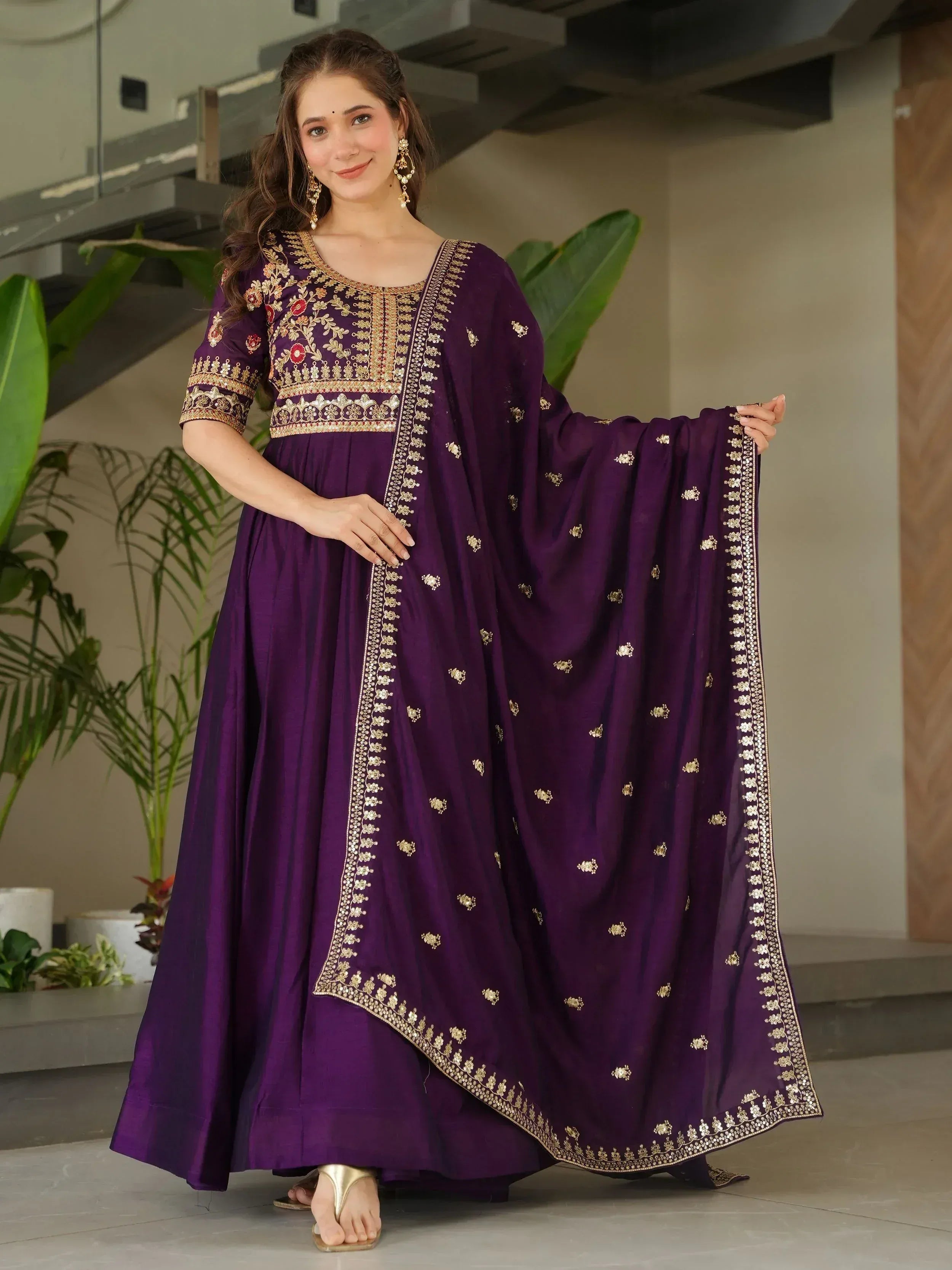 Purple embroidered Anarkali suit with gold detailing, perfect for Indian ethnic wear occasions