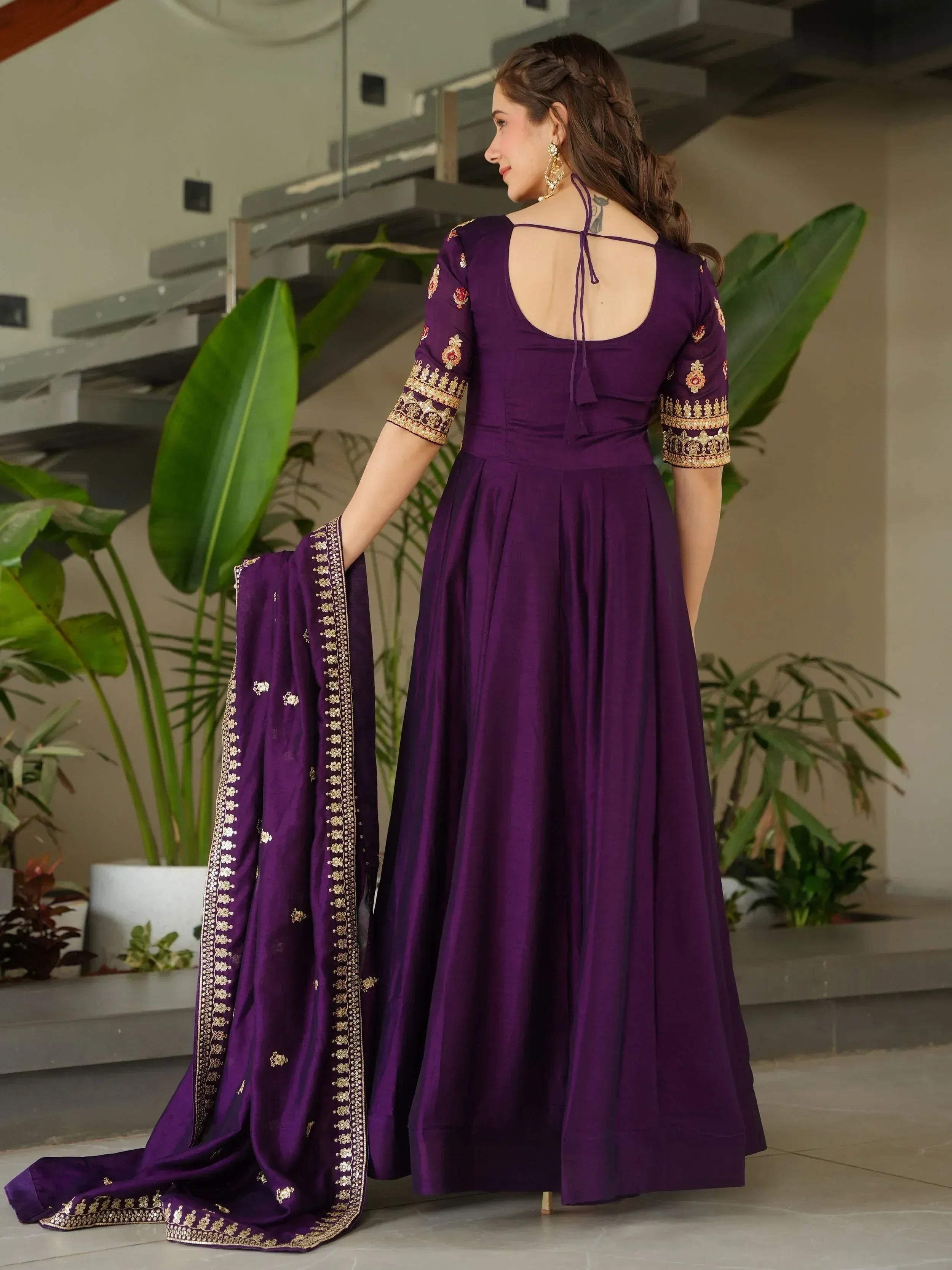 Purple ethnic anarkali with gold embroidery and back tie, paired with matching dupatta for festive wear