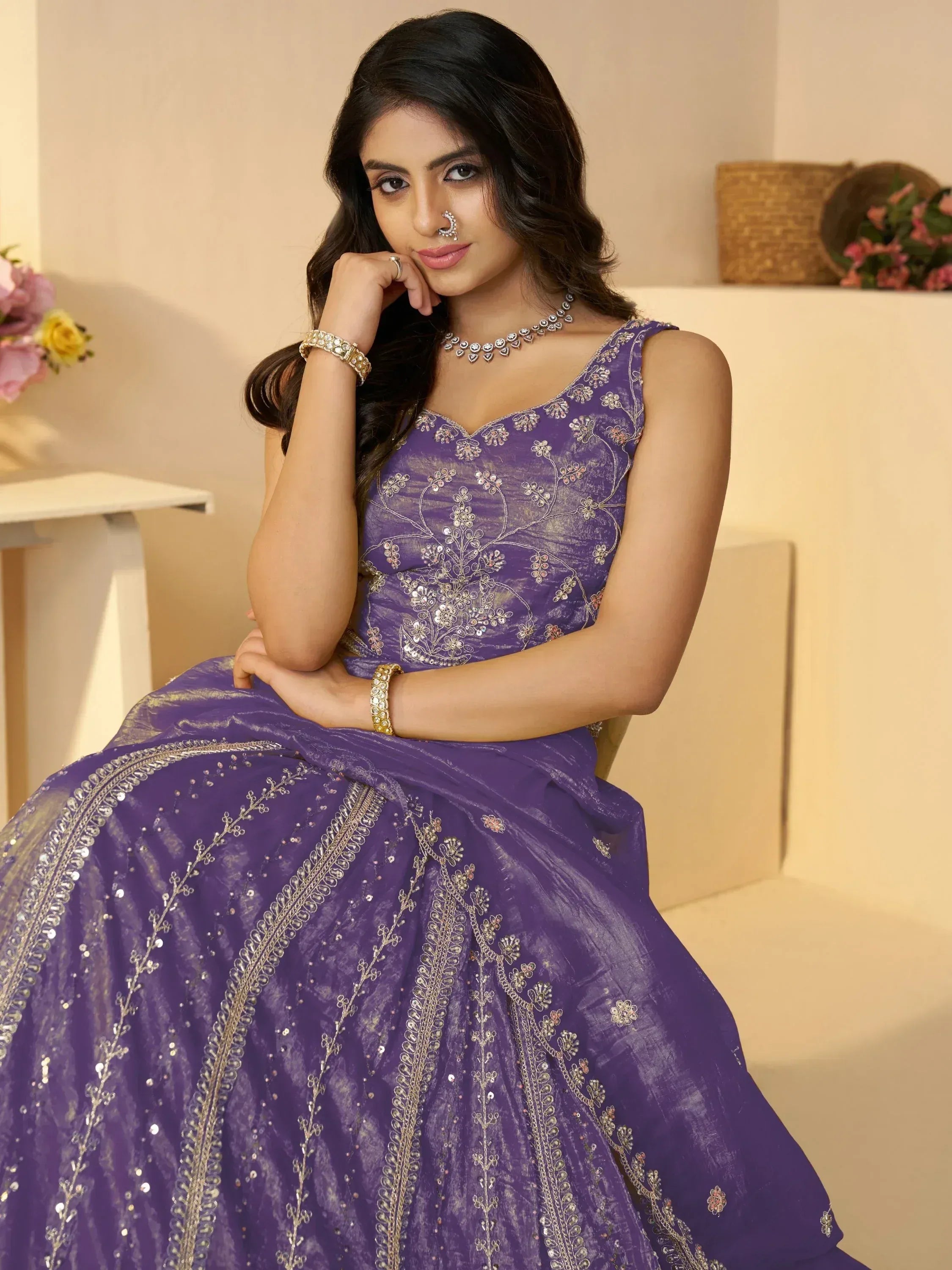 Purple embroidered lehenga choli with gold detailing, perfect for Indian ethnic wear and festive occasions.