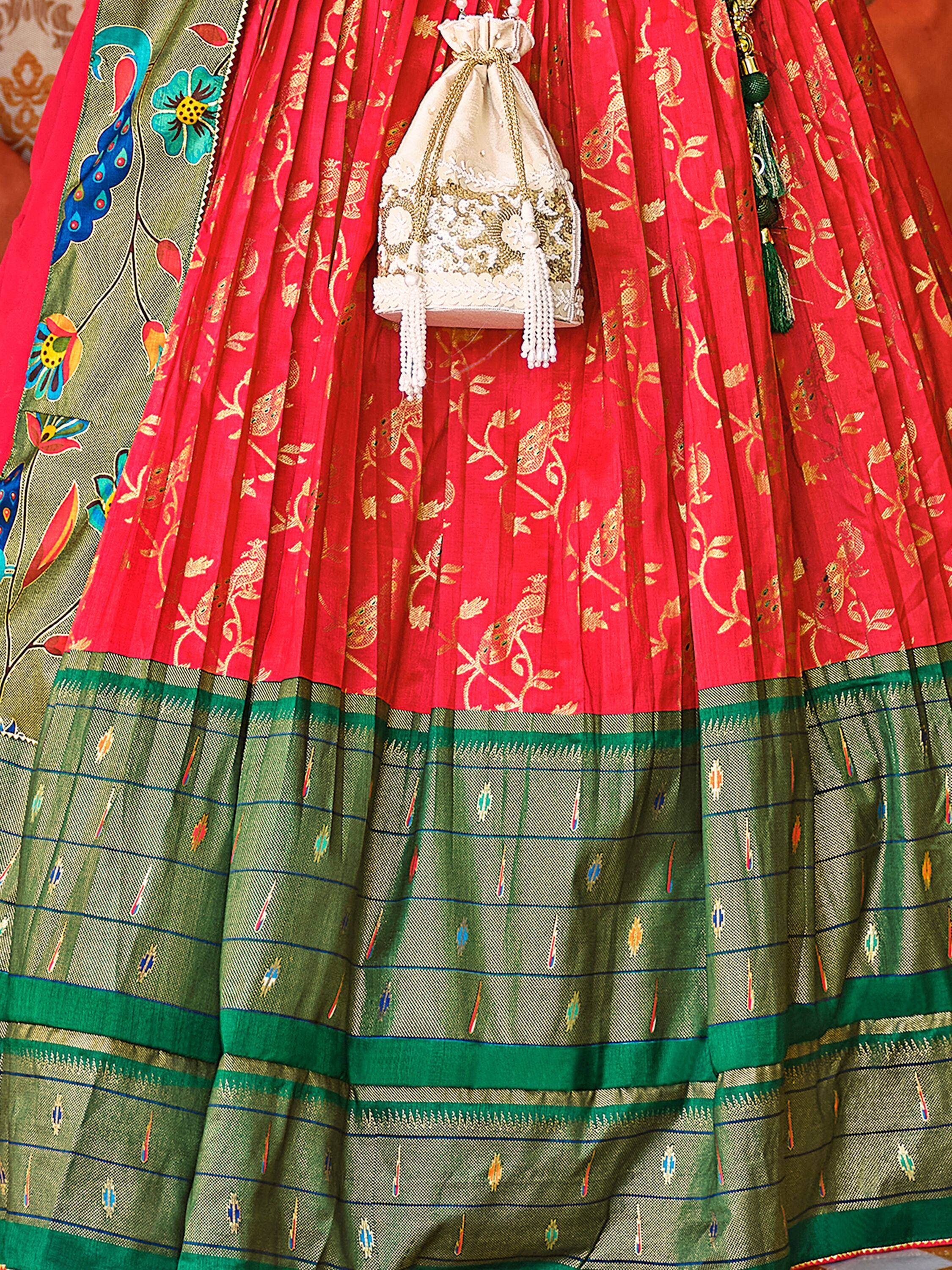 Red and green ethnic lehenga with gold embroidery, peacock motifs, and matching potli bag for Indian weddings