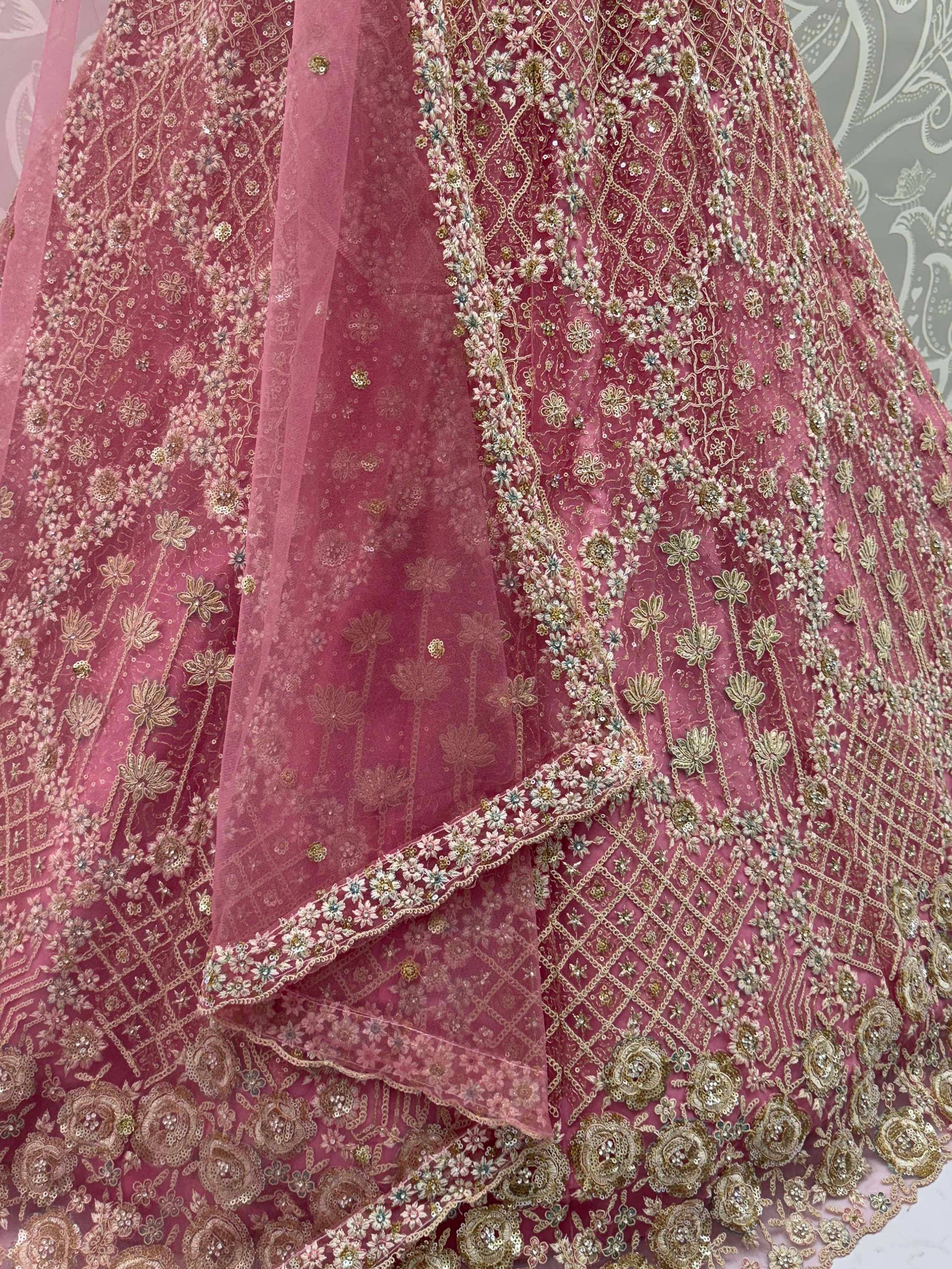 Pink designer lehenga with gold floral embroidery and sequin detailing, perfect for Indian ethnic wear