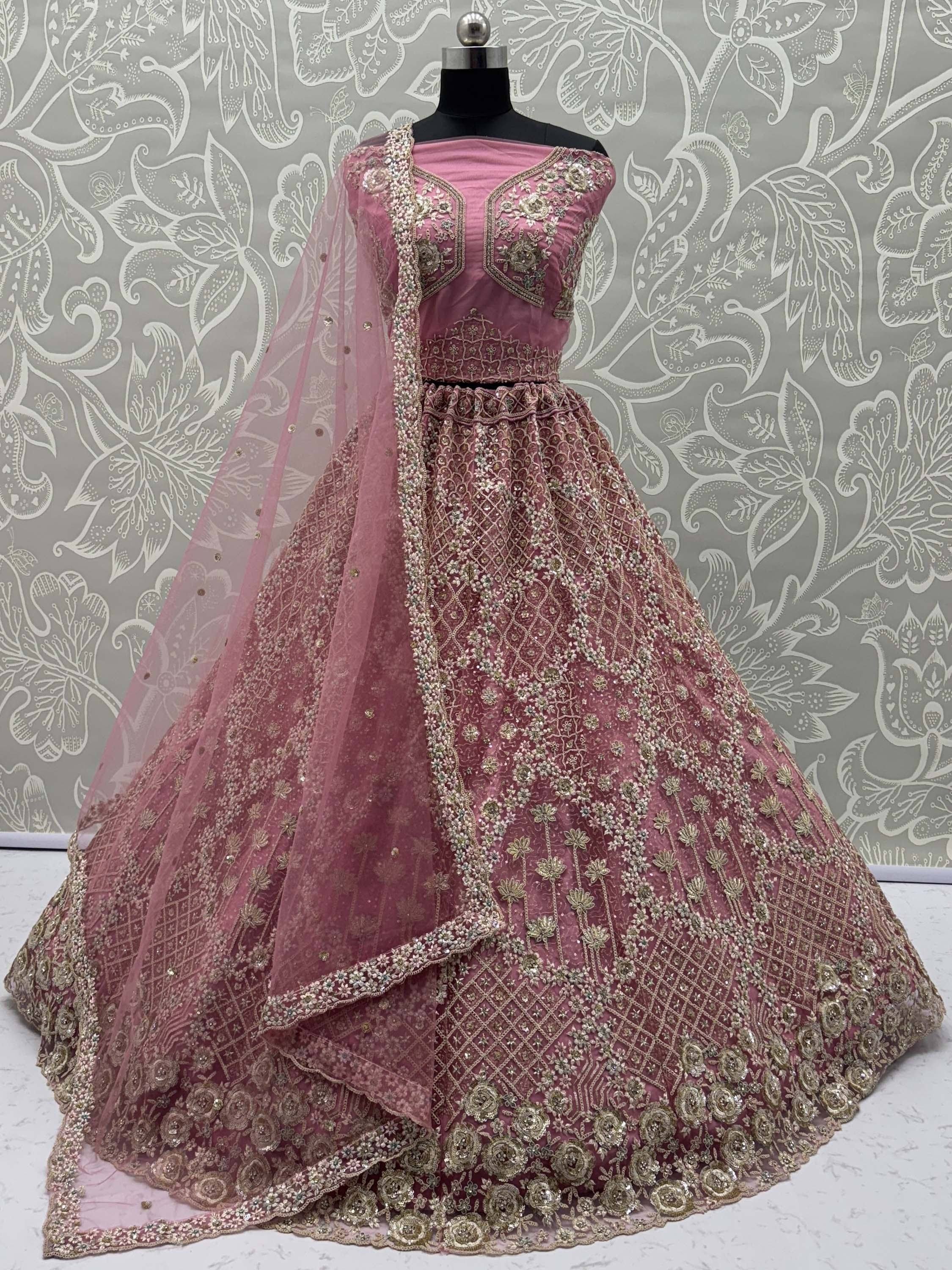 Pink designer lehenga choli with heavy gold embroidery and net dupatta, ethnic Indian wear
