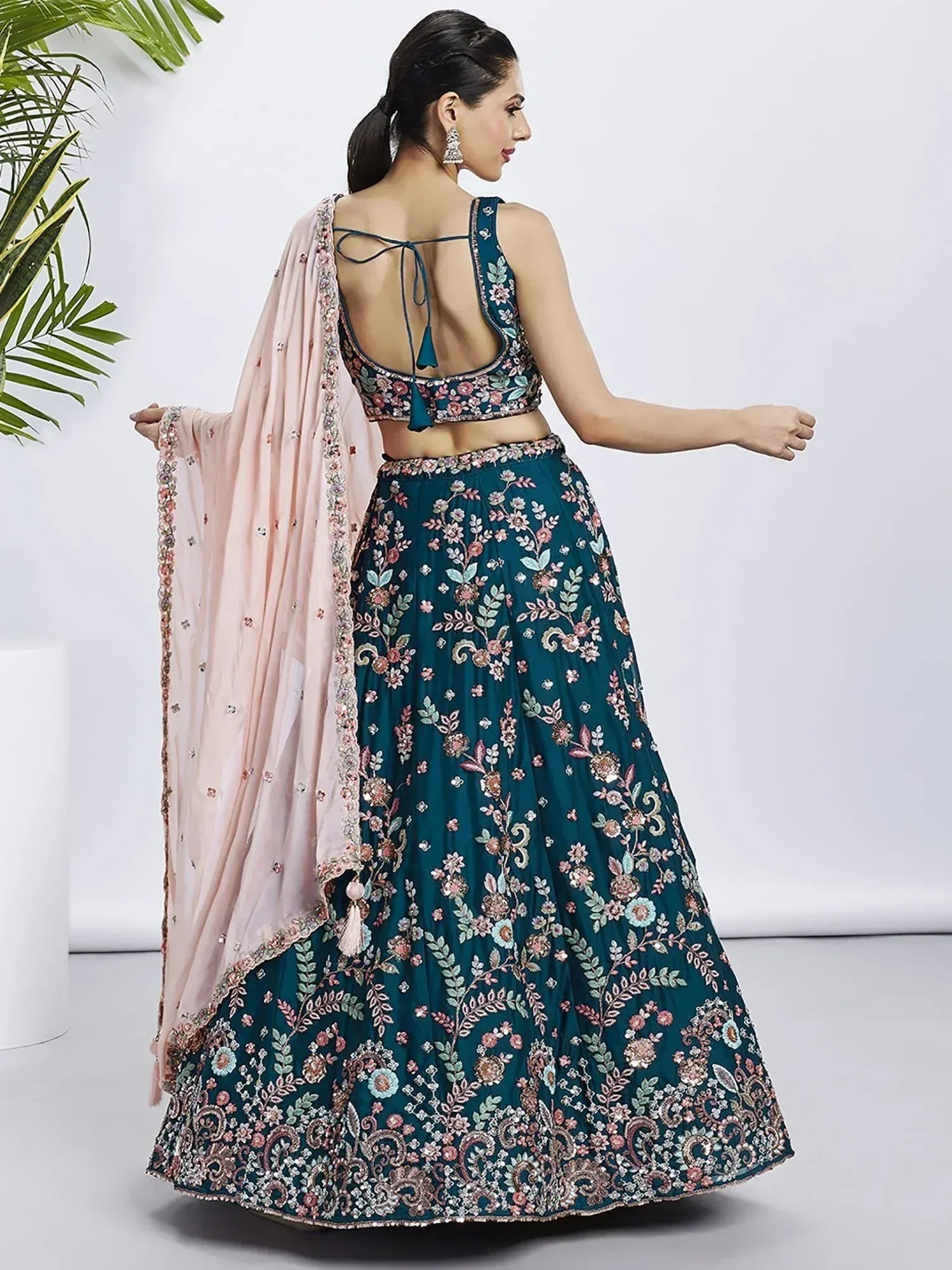 Teal floral embroidered lehenga choli with pink dupatta, perfect for Indian ethnic wear