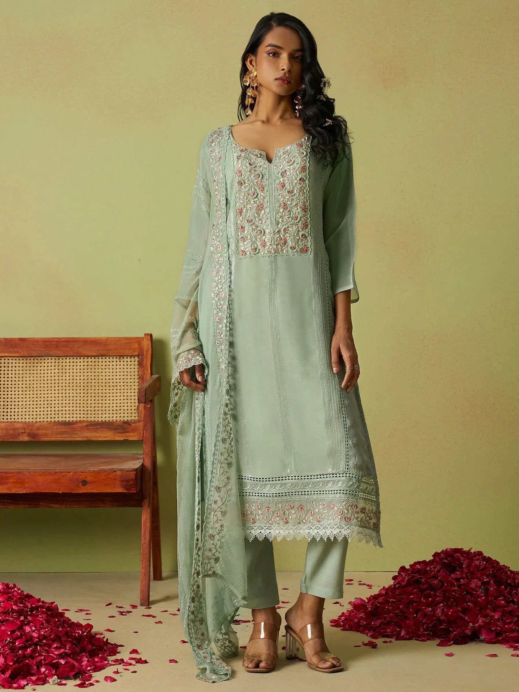 Mint green embroidered salwar kameez with floral detailing, perfect for ethnic occasions