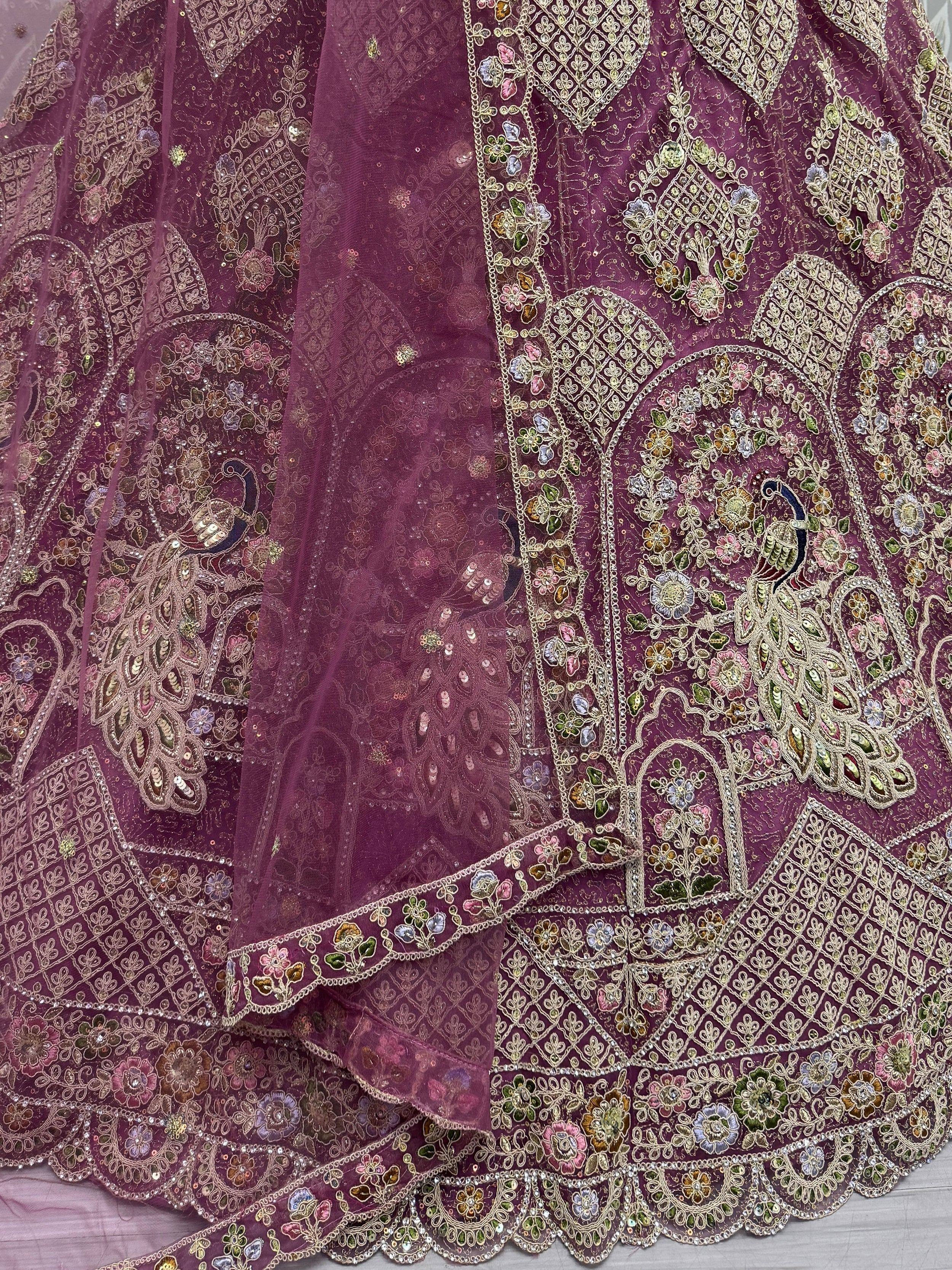 Purple embroidered lehenga with peacock motifs and floral zari work, ideal for Indian ethnic wear