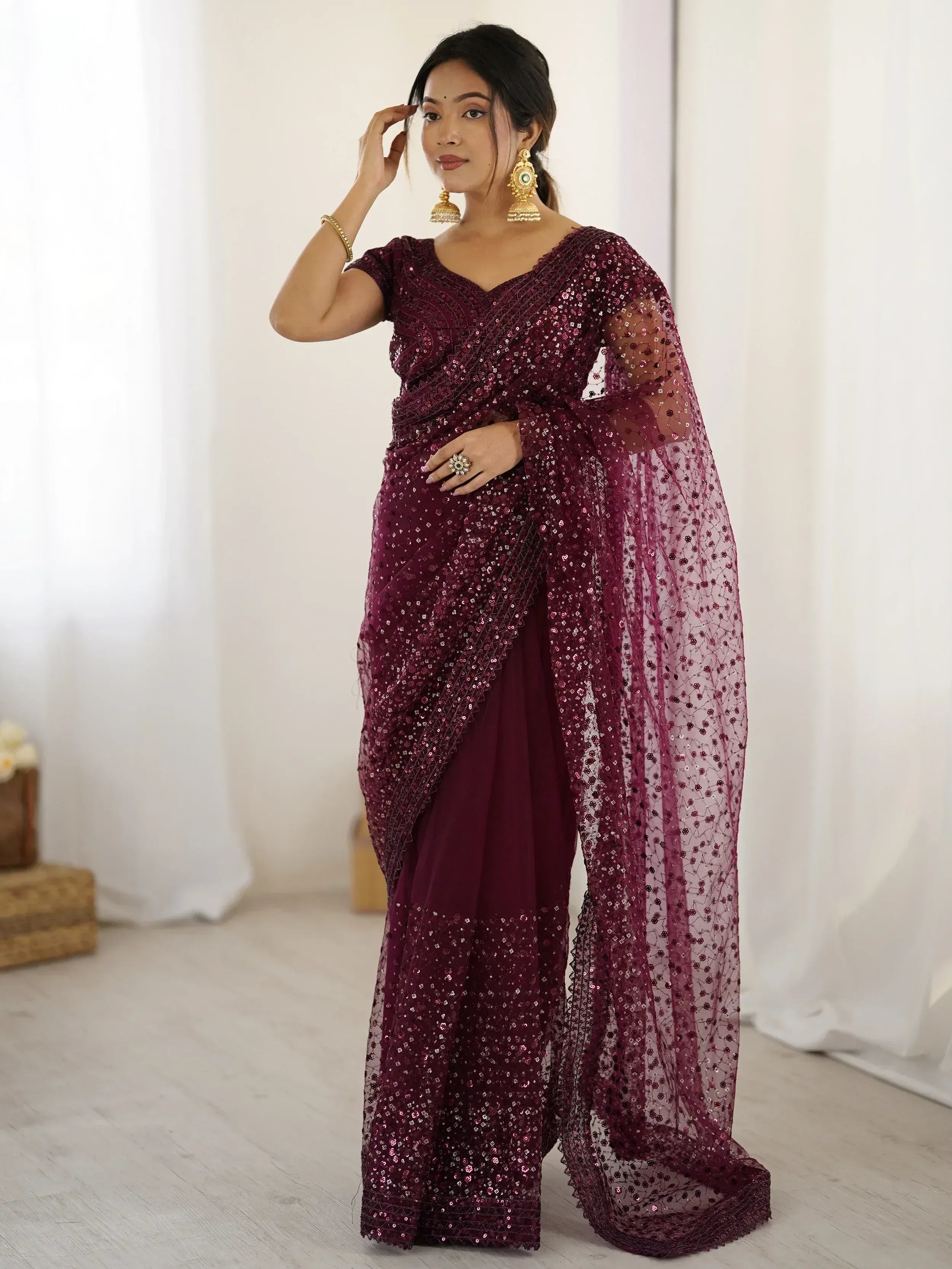 Burgundy sequin saree with sheer overlay, perfect for Indian ethnic wear and festive occasions.