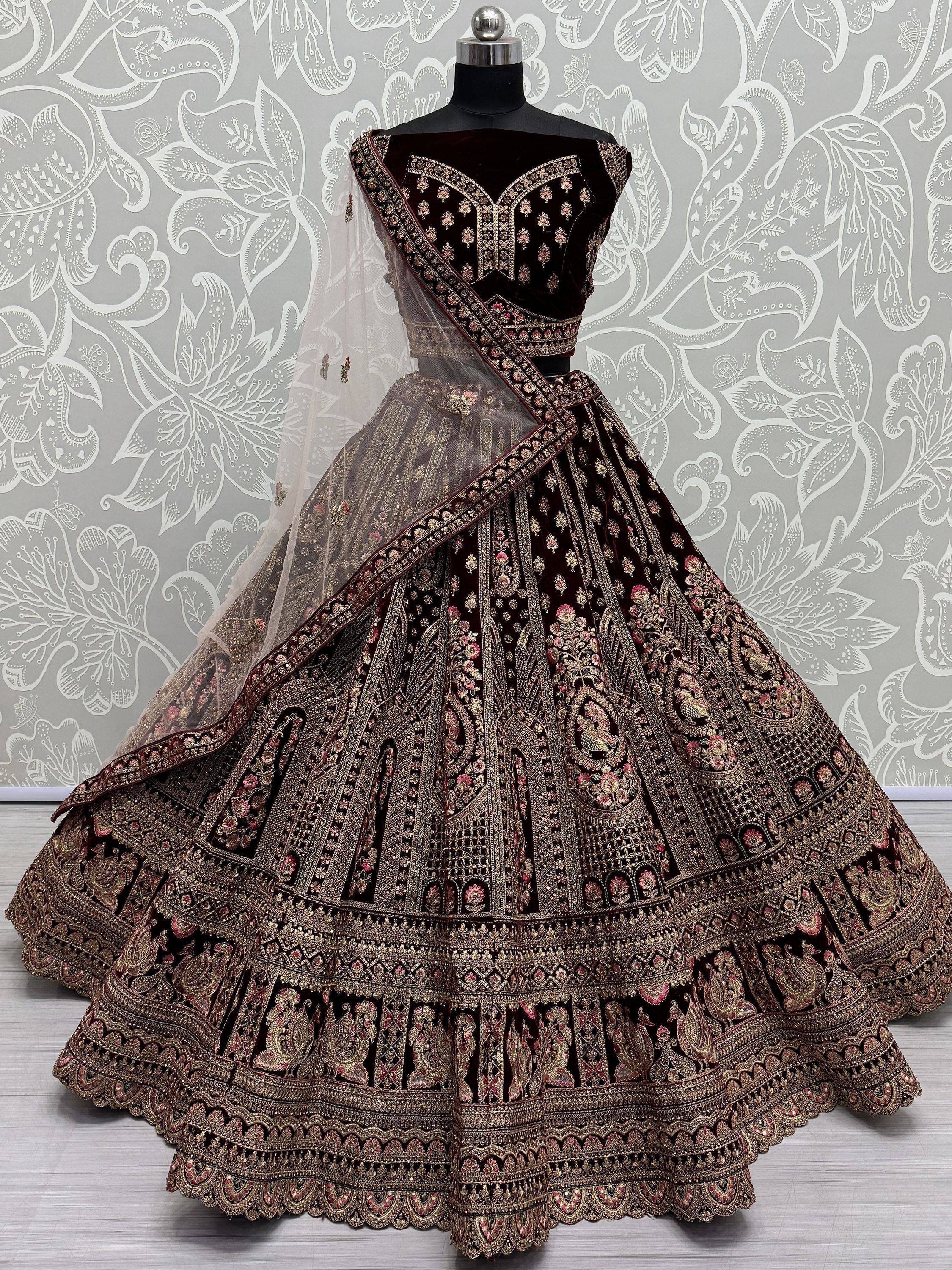 Dark velvet designer lehenga choli with heavy gold and pink embroidery, sheer dupatta, ethnic Indian wear