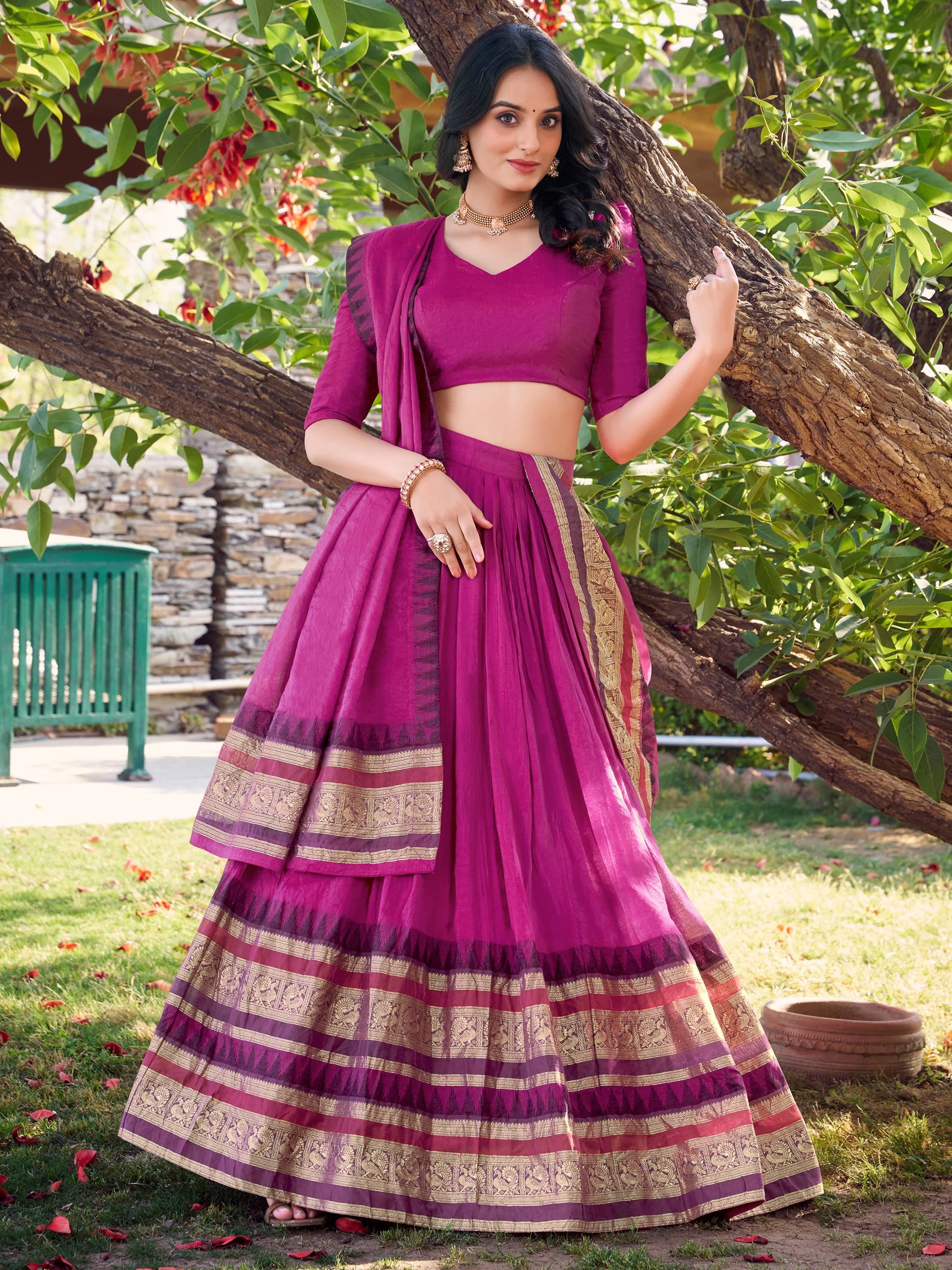 Woman in purple designer lehenga choli with gold border, perfect for Indian ethnic occasions