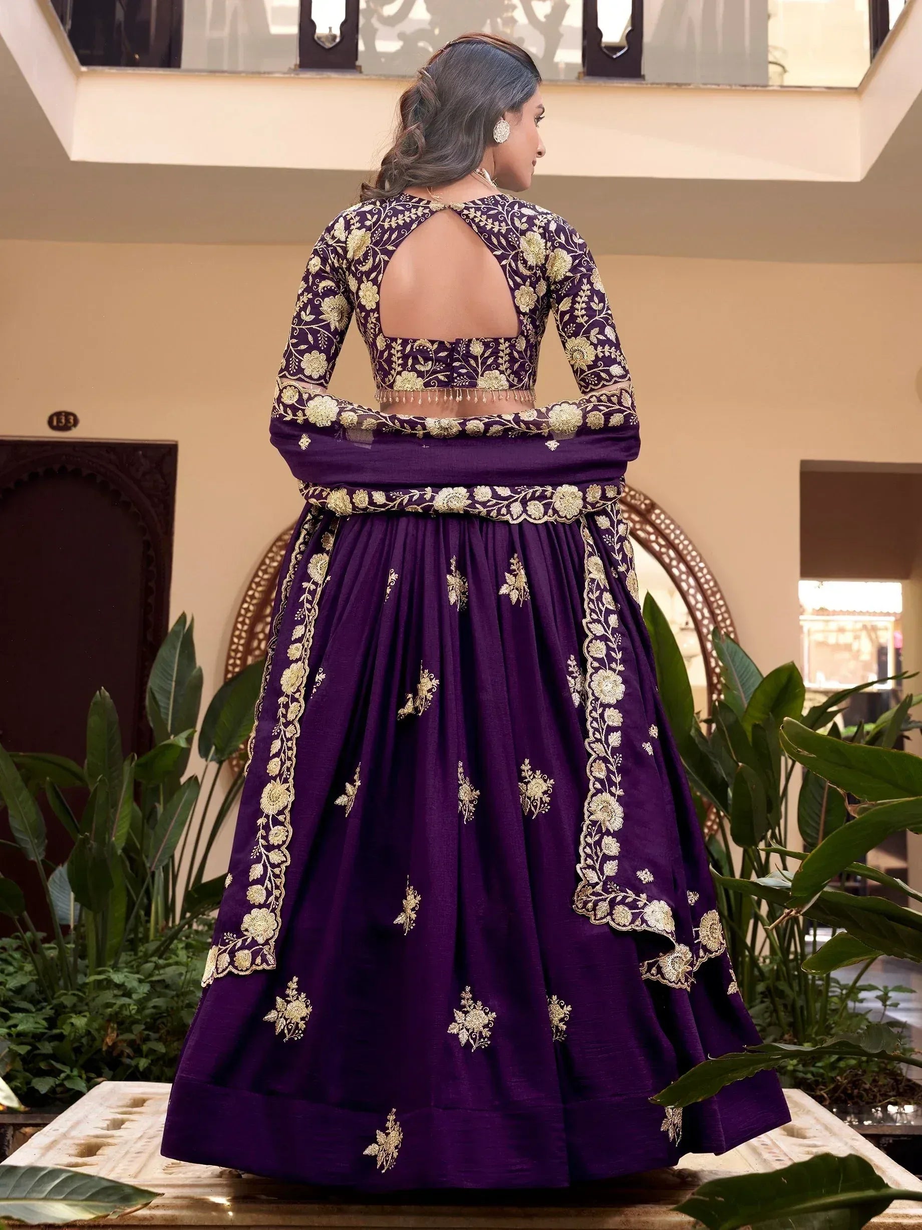 Purple embroidered lehenga choli with gold floral work, back view, ethnic wear for women