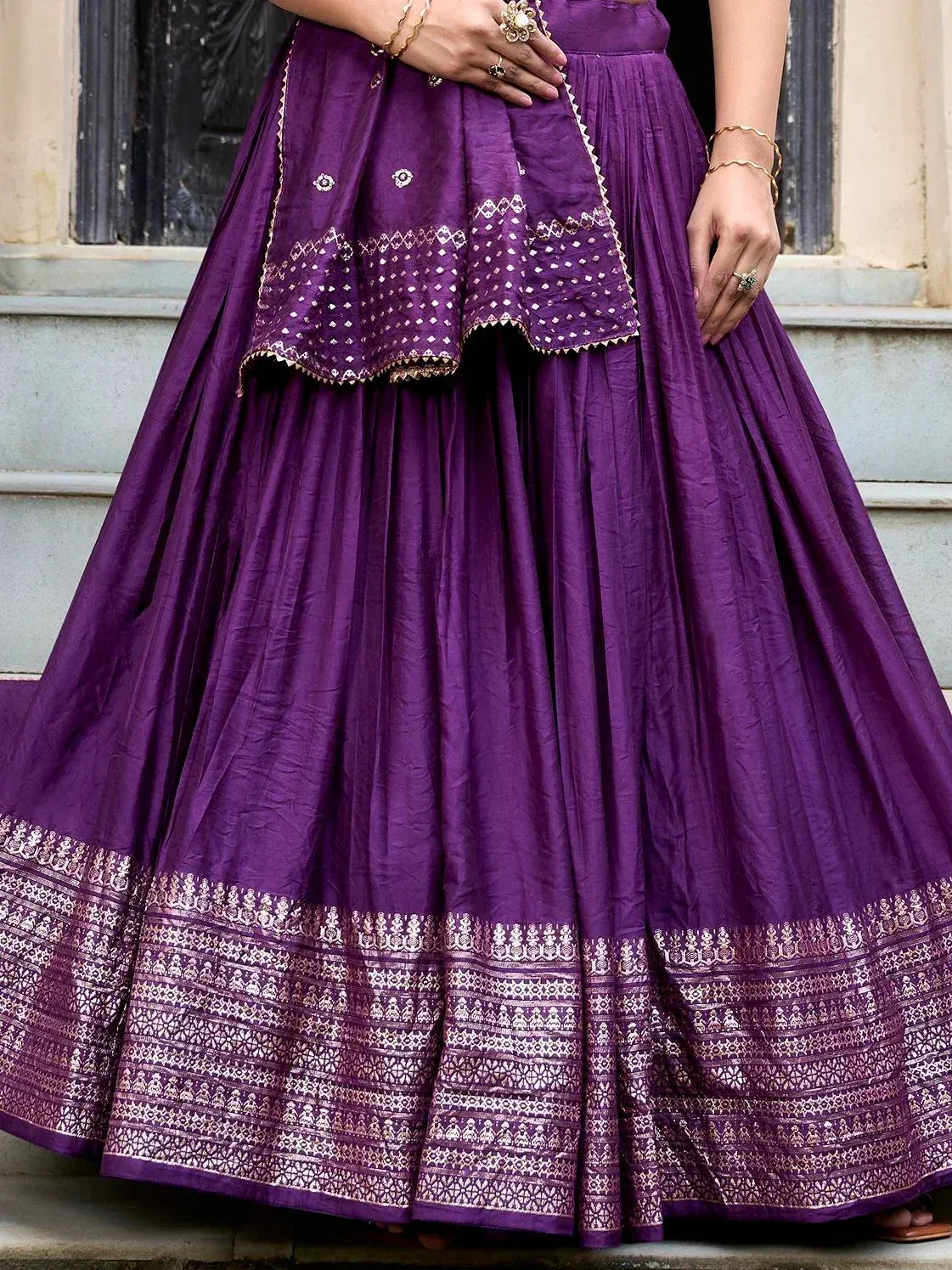 Purple ethnic lehenga with gold embroidery and pleated skirt, perfect for Indian weddings and festivals