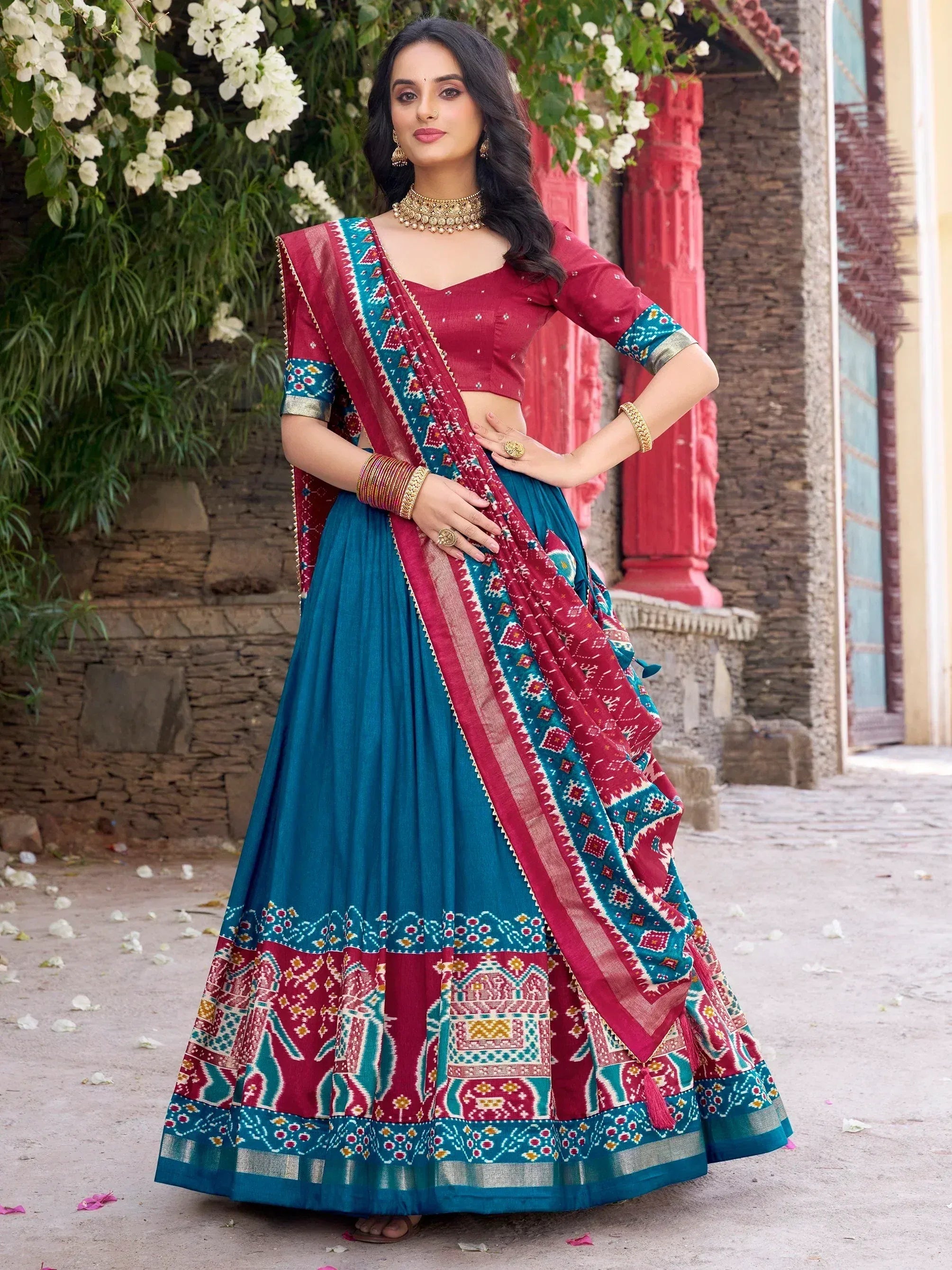 Teal and maroon printed lehenga choli with ethnic motifs, perfect for Indian festive occasions