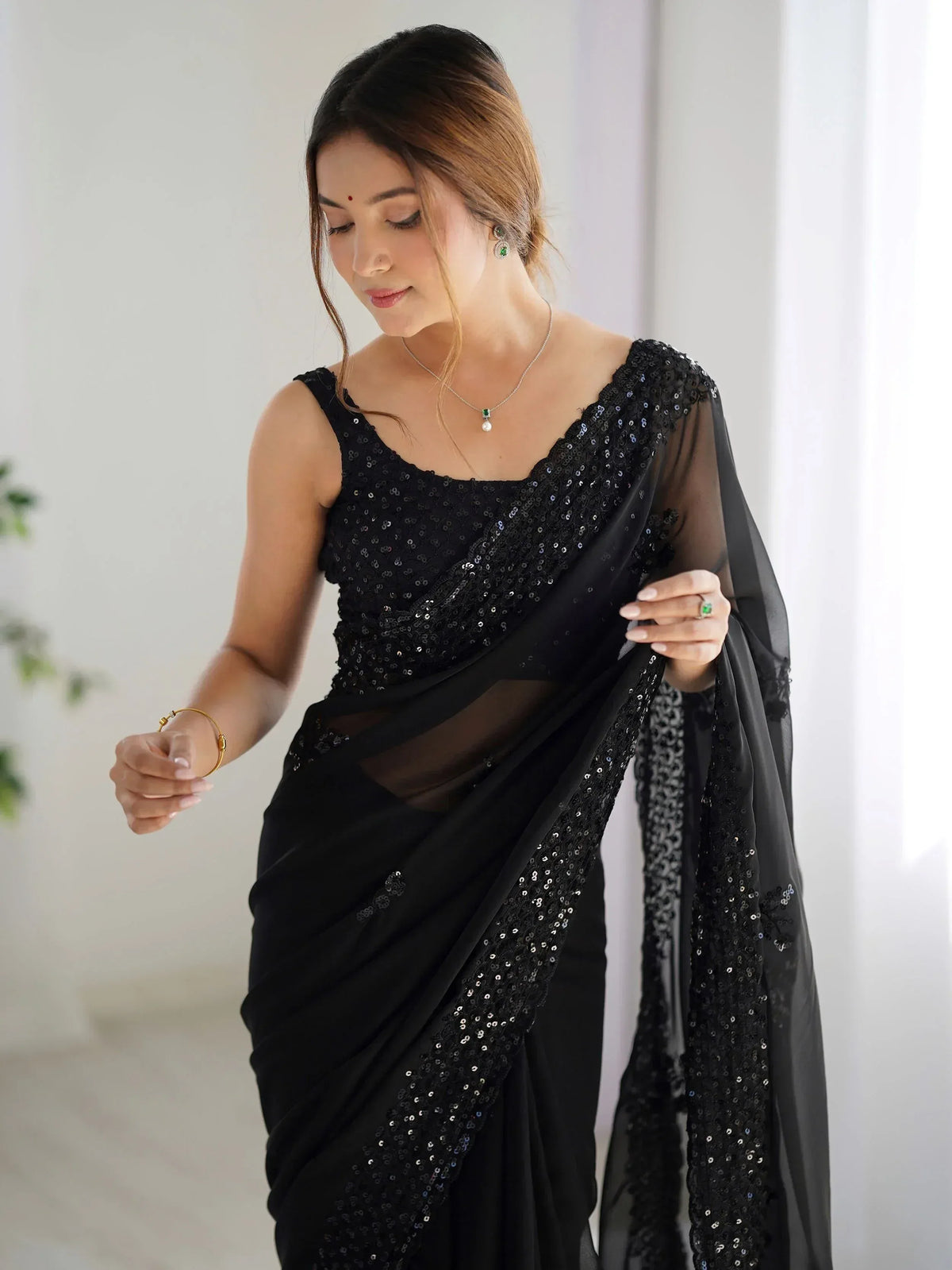 Black sequin saree with sheer blouse, elegant Indian ethnic wear for women