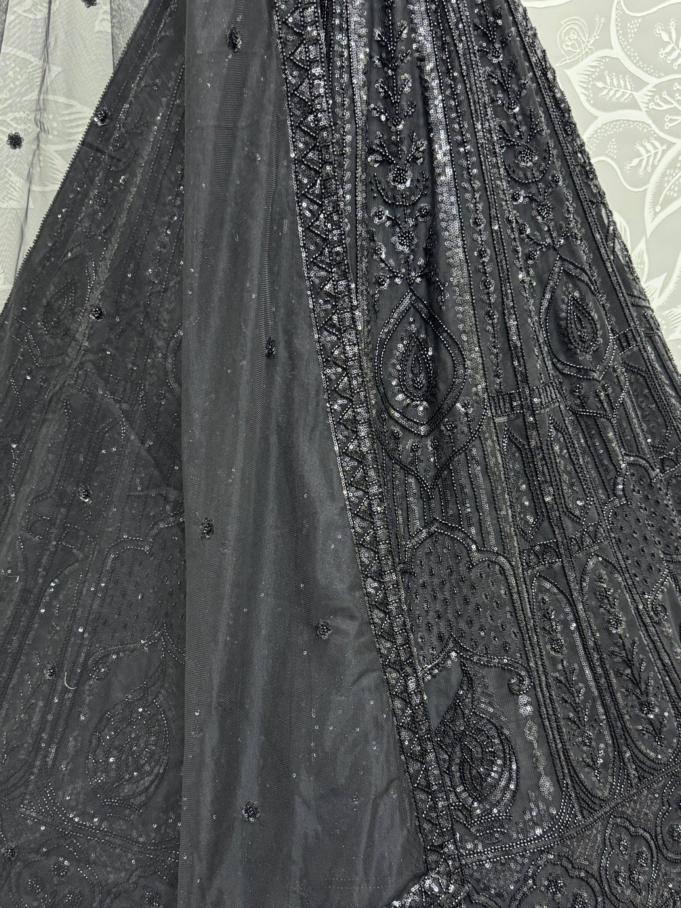 Black designer lehenga with intricate sequin and bead embroidery, perfect for Indian ethnic wear events.