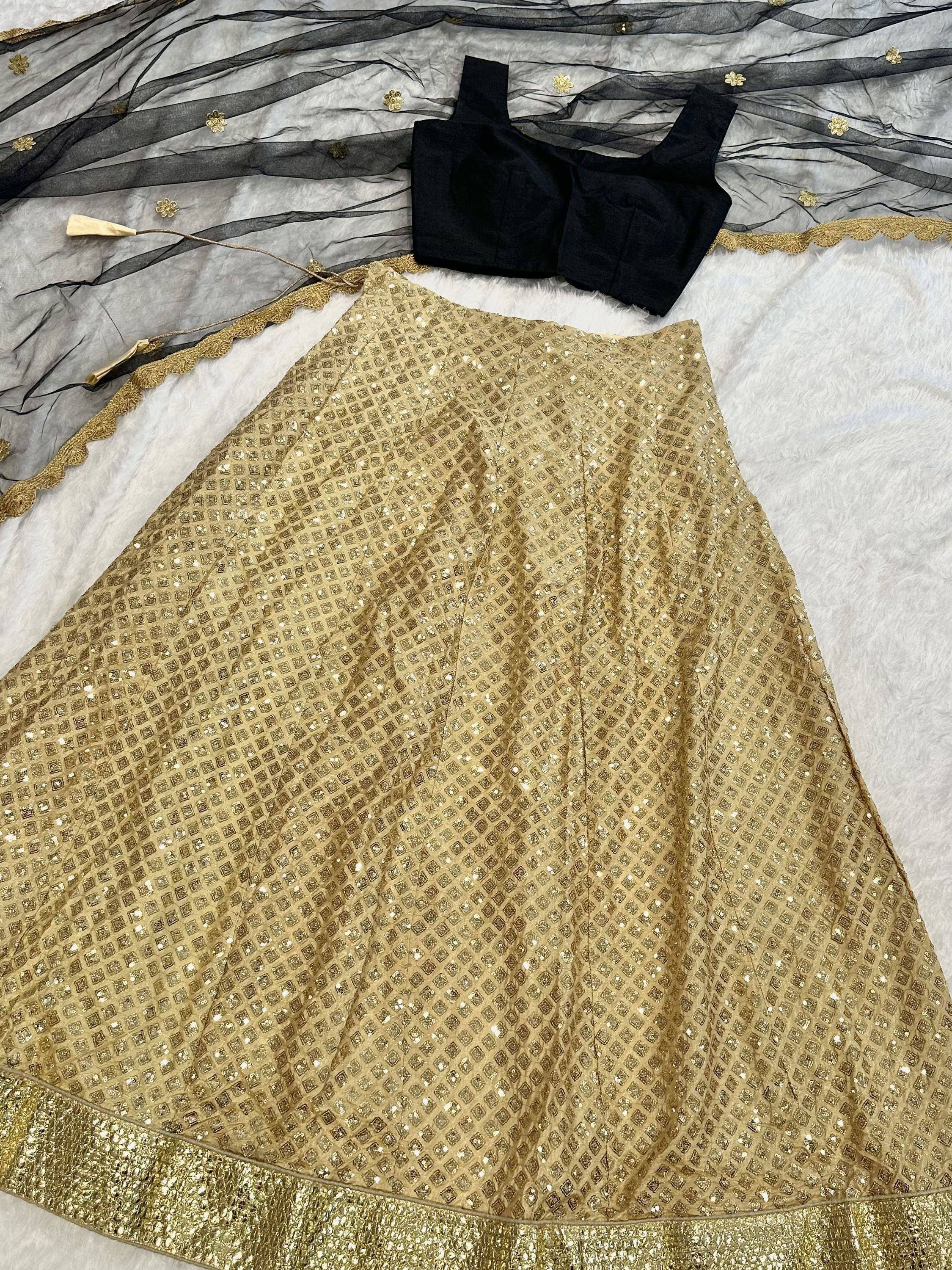 Gold sequin lehenga with black blouse and sheer dupatta, ethnic Indian wear