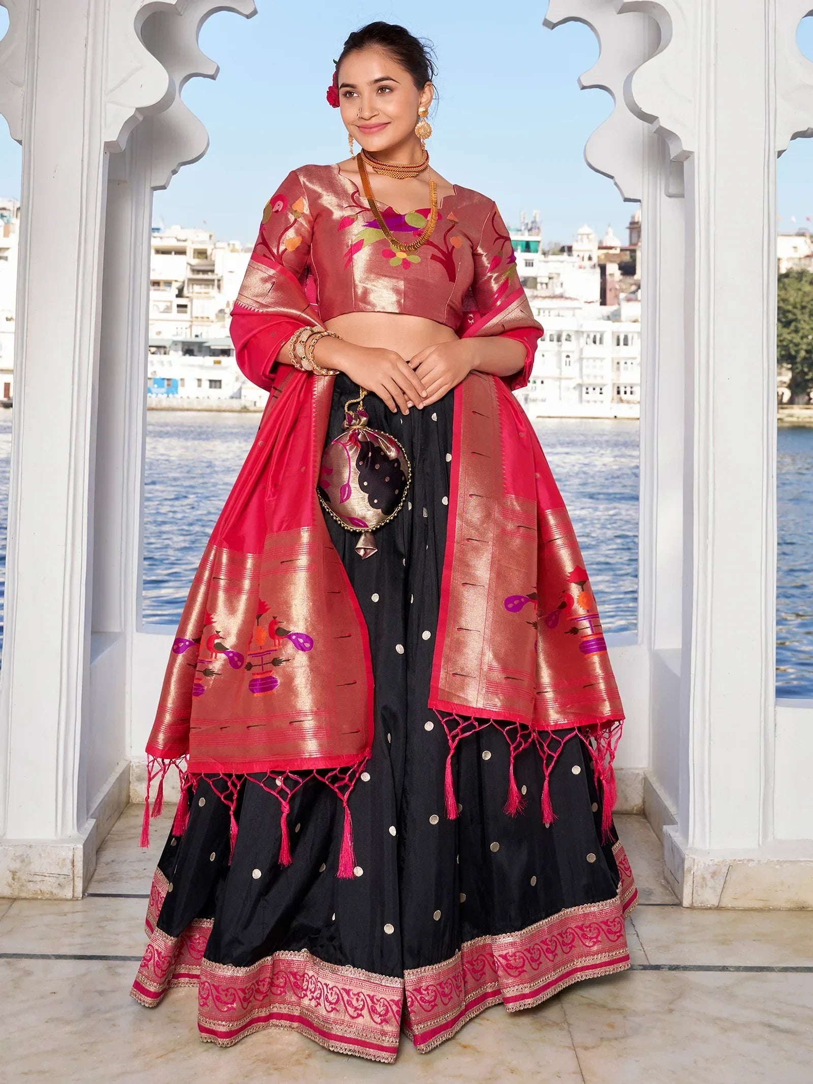 Black and pink embroidered lehenga choli with floral dupatta, perfect for Indian ethnic occasions