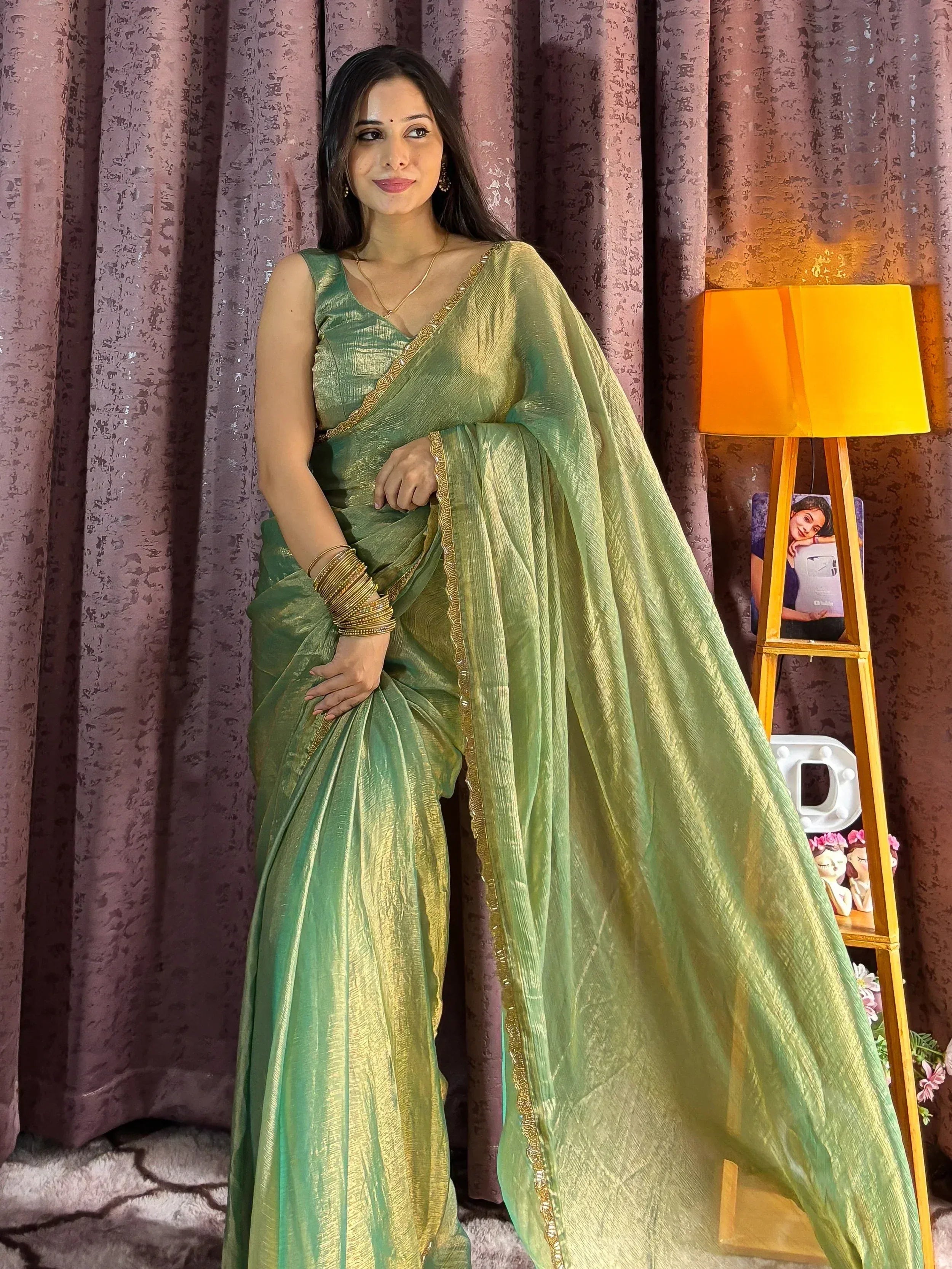 Elegant green and gold saree with golden border, perfect for Indian ethnic occasions