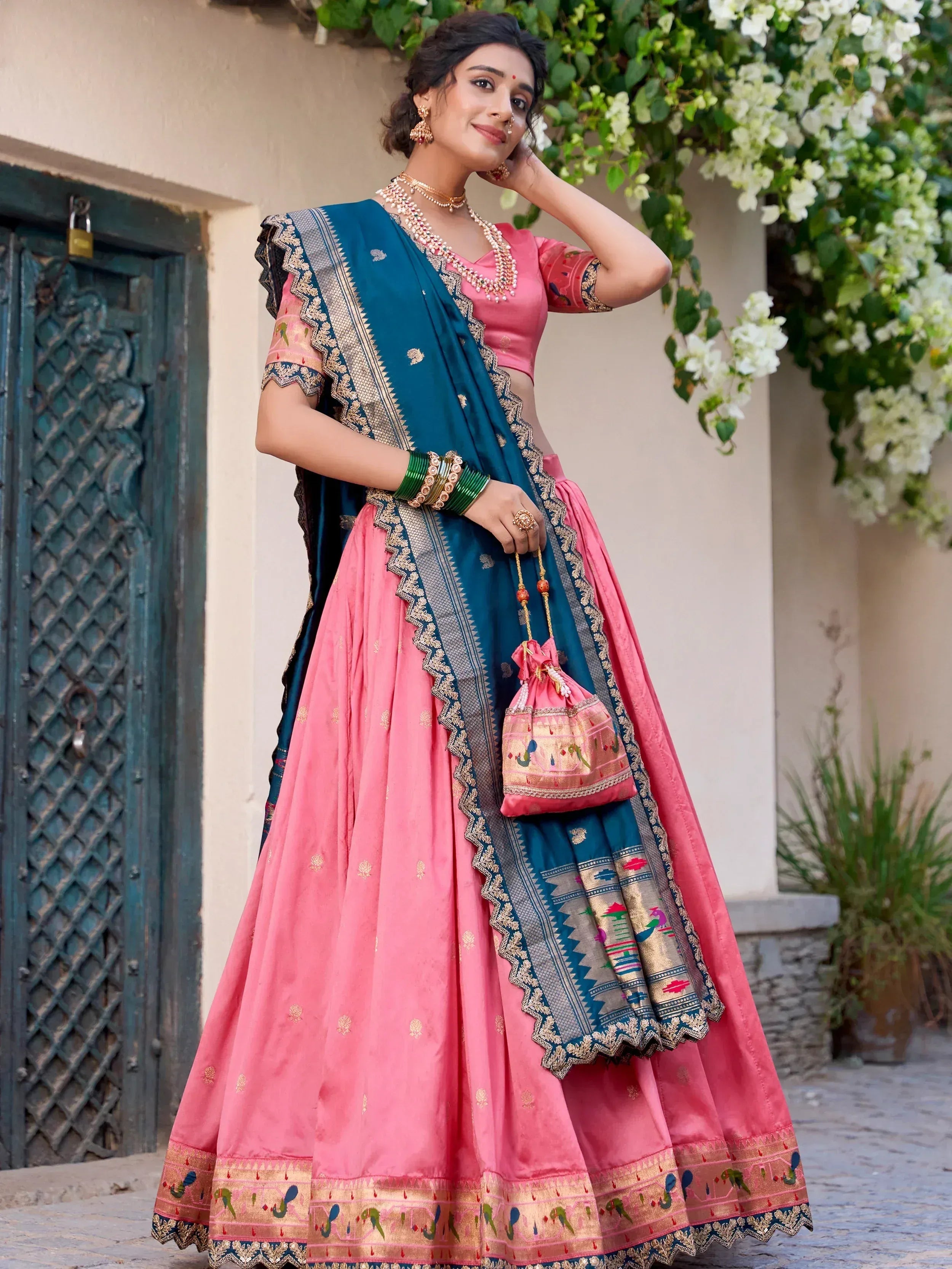 Pink and teal designer lehenga choli with embroidered dupatta, perfect for Indian ethnic wear occasions