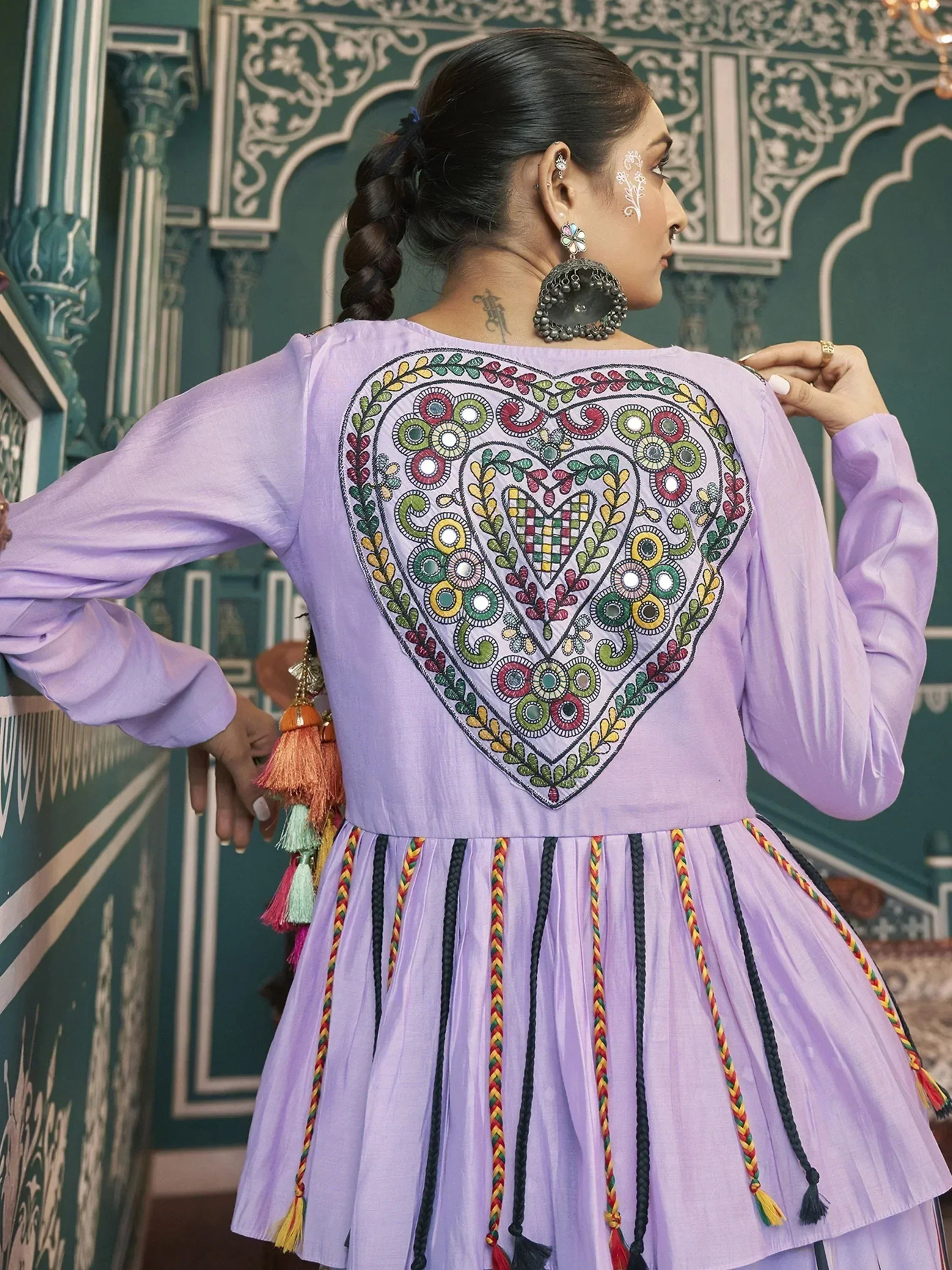 Purple ethnic gown with heart embroidery and tassels, perfect for Indian festive wear