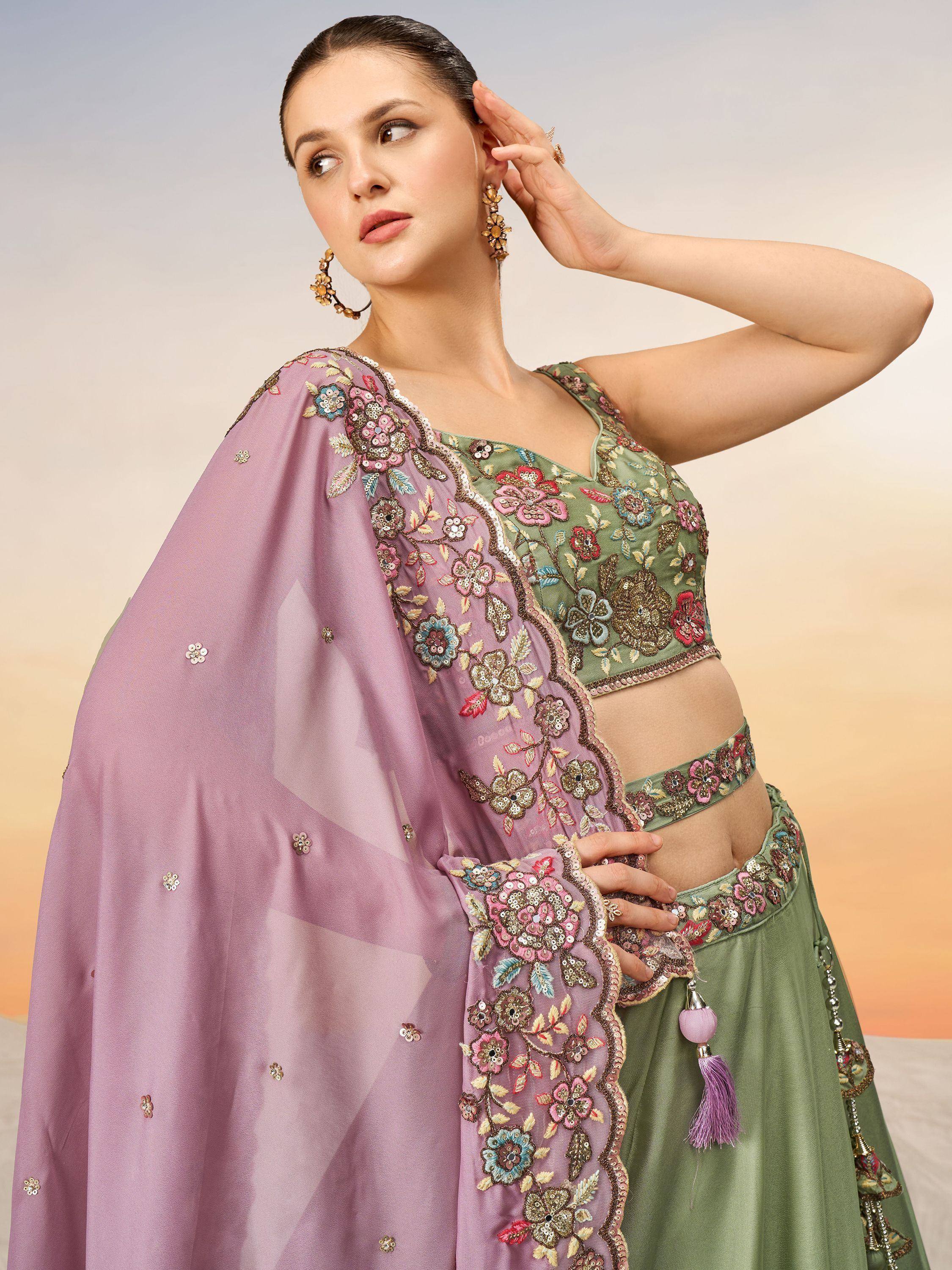 Elegant green lehenga choli with floral embroidery and pink dupatta, perfect for Indian ethnic occasions.