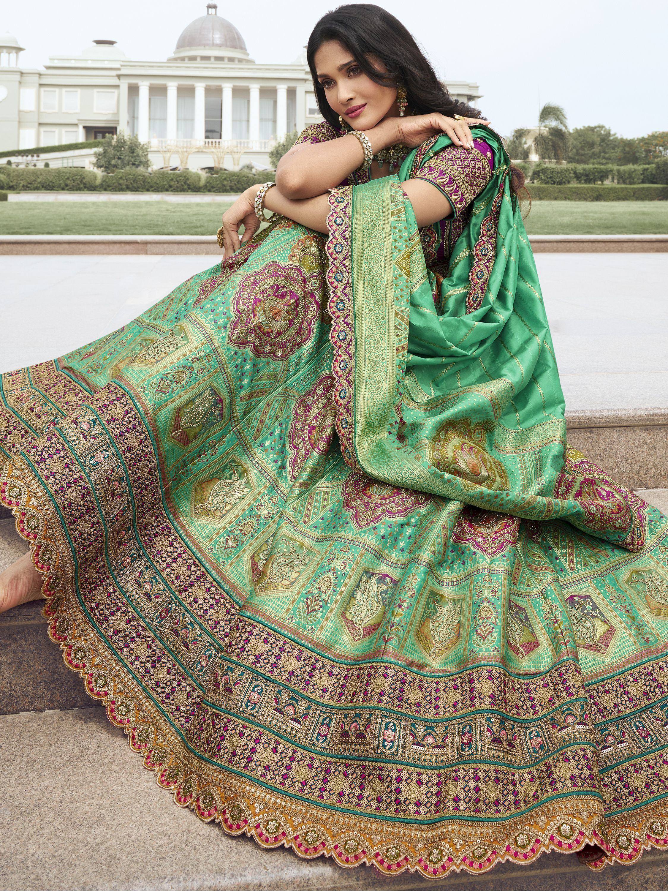 Elegant green and purple designer lehenga choli with intricate embroidery, perfect for Indian ethnic wear.