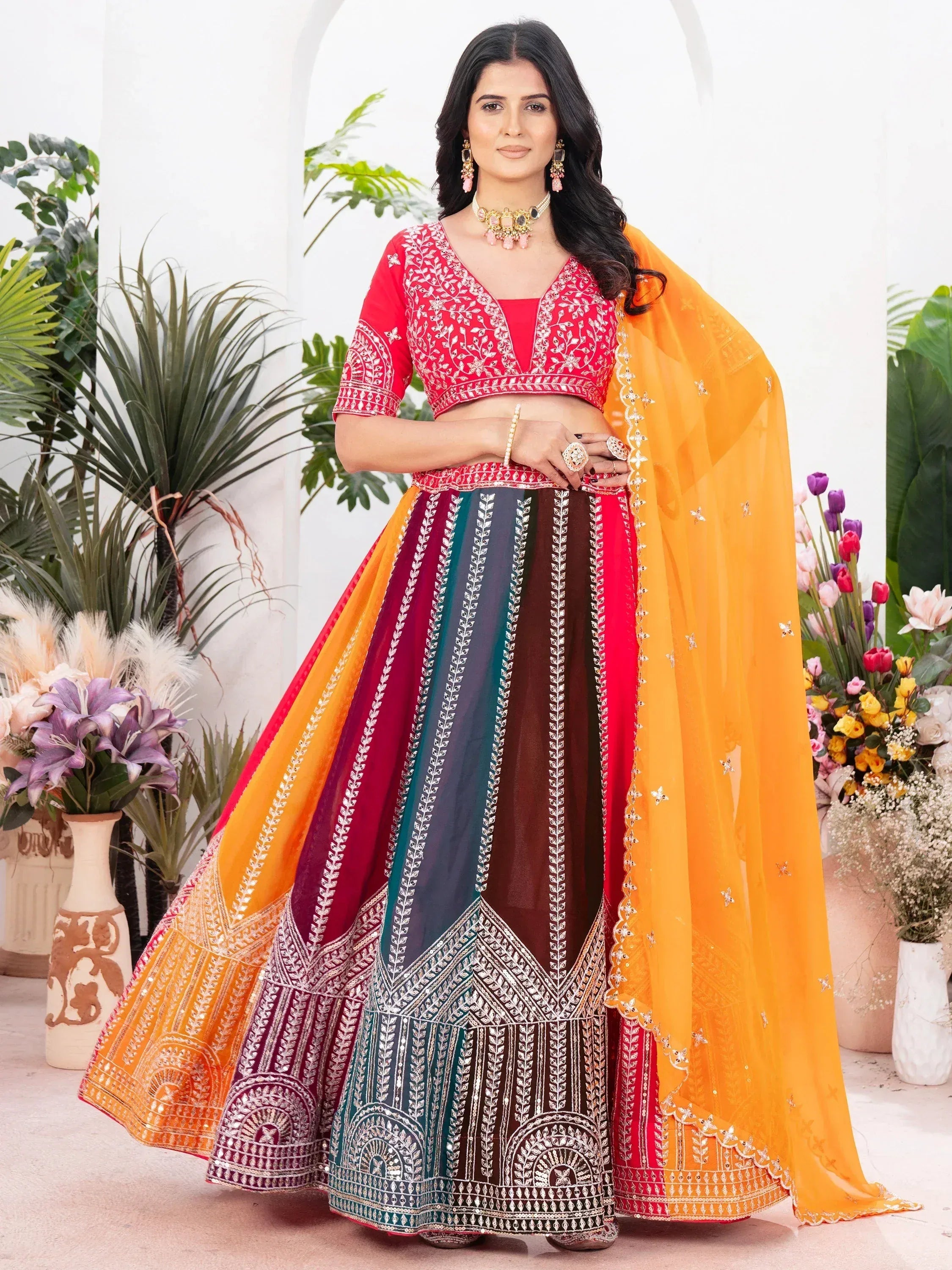 Vibrant multicolor lehenga choli with intricate embroidery and orange dupatta, perfect for Indian ethnic occasions