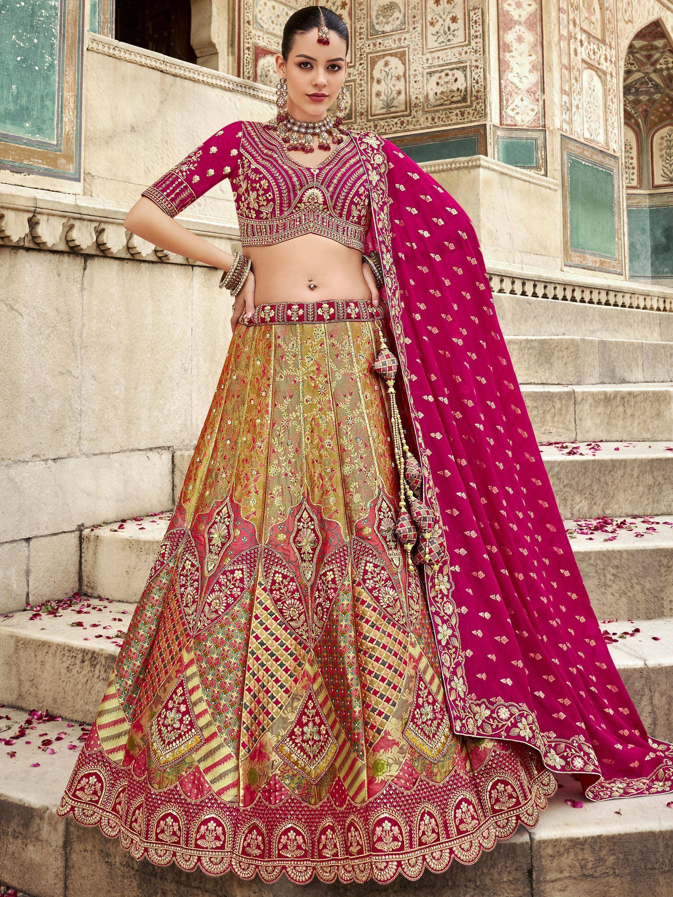 Elegant maroon and gold embroidered lehenga choli with dupatta, perfect for Indian weddings and festive occasions.