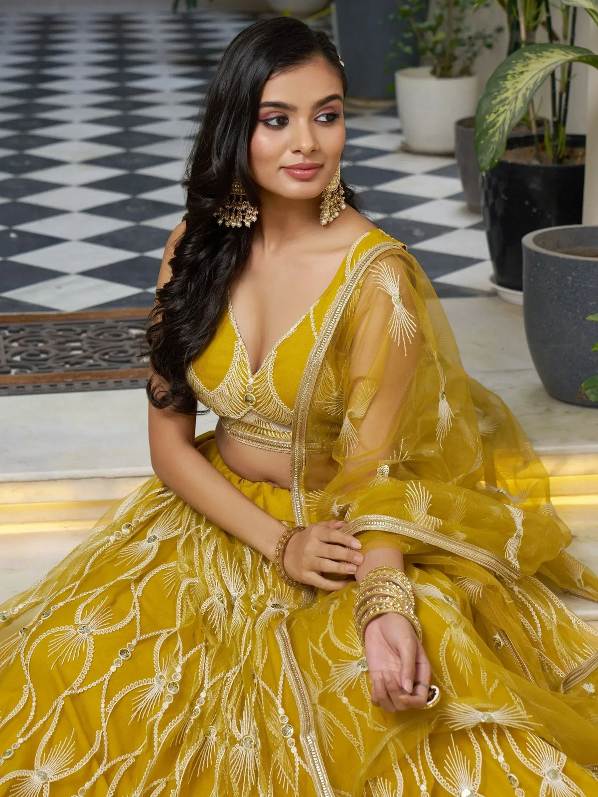 Yellow designer lehenga choli with gold embroidery, perfect for Indian ethnic wear events