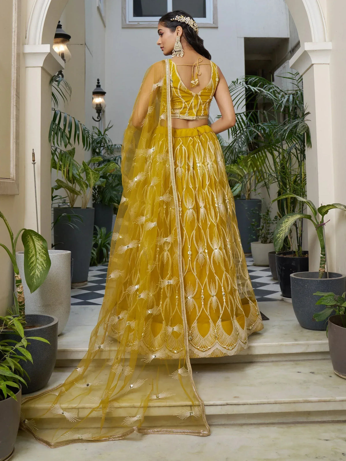 Mustard yellow embroidered lehenga choli with sheer dupatta, perfect for Indian ethnic occasions