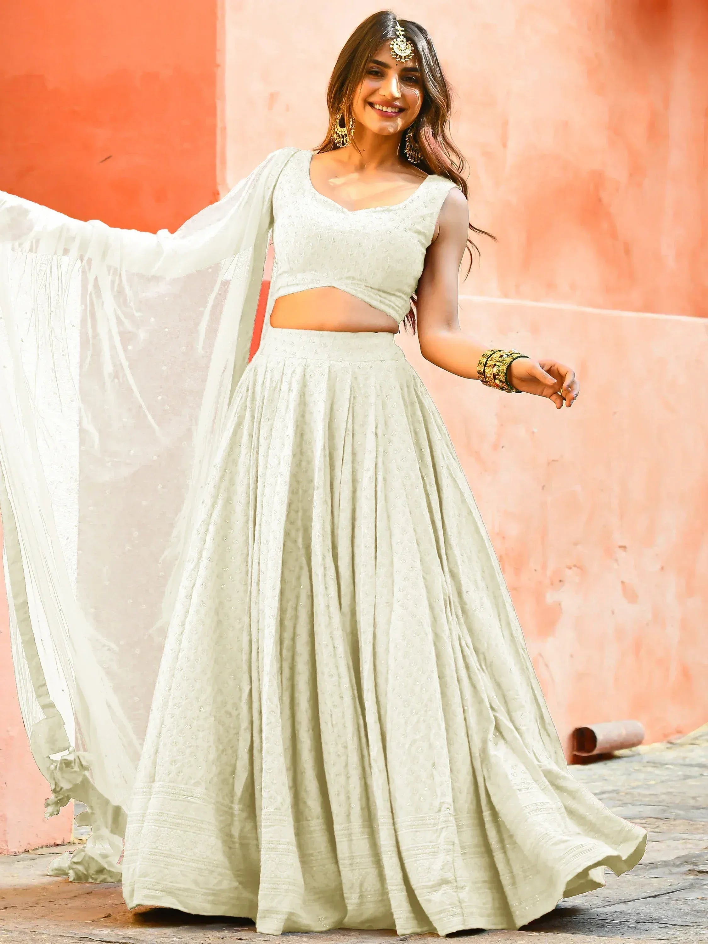 Elegant mint green lehenga choli with sheer dupatta, perfect for Indian ethnic occasions