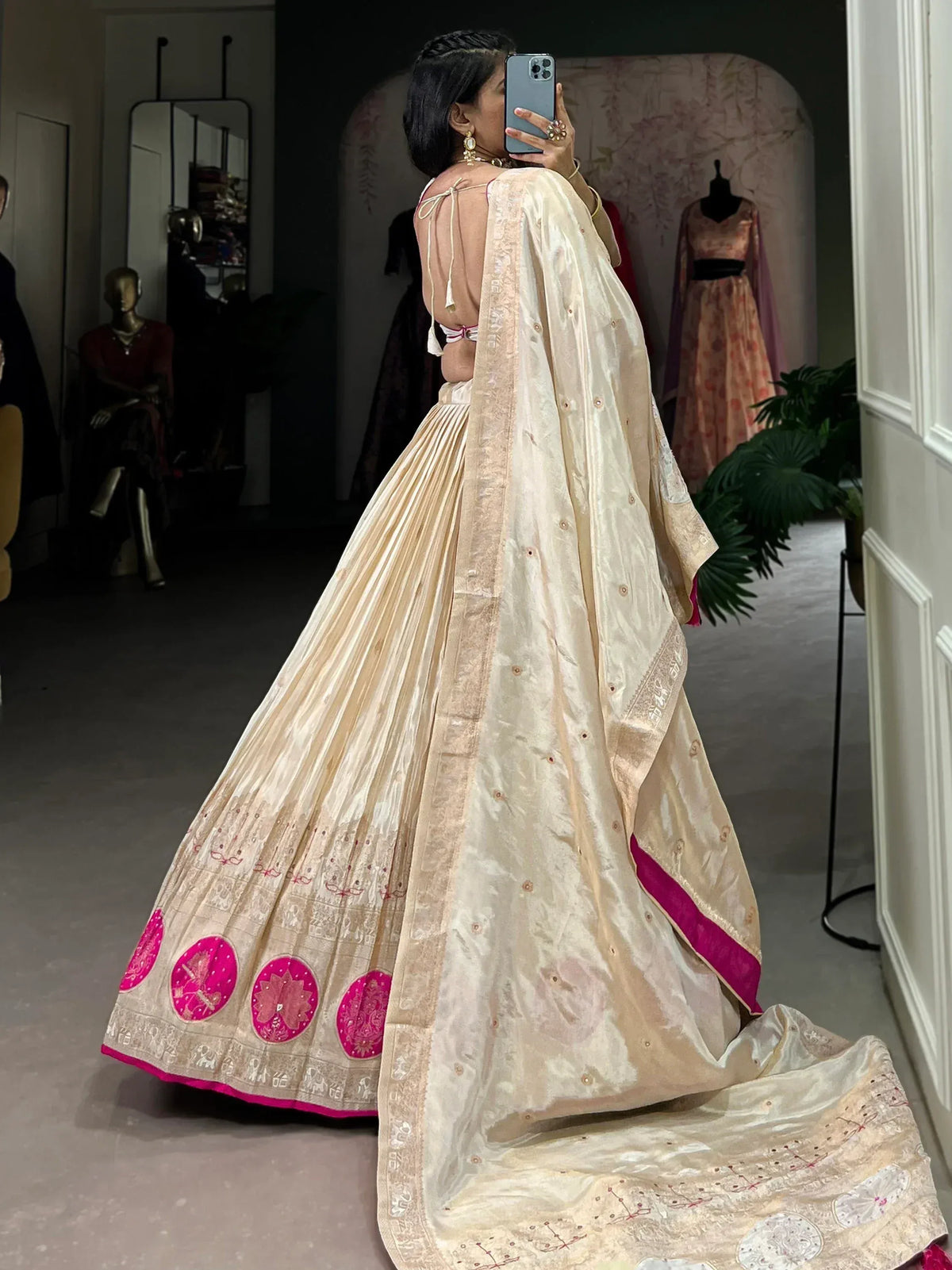 Cream and pink embroidered lehenga choli with mirror work, perfect for Indian weddings and festive occasions.