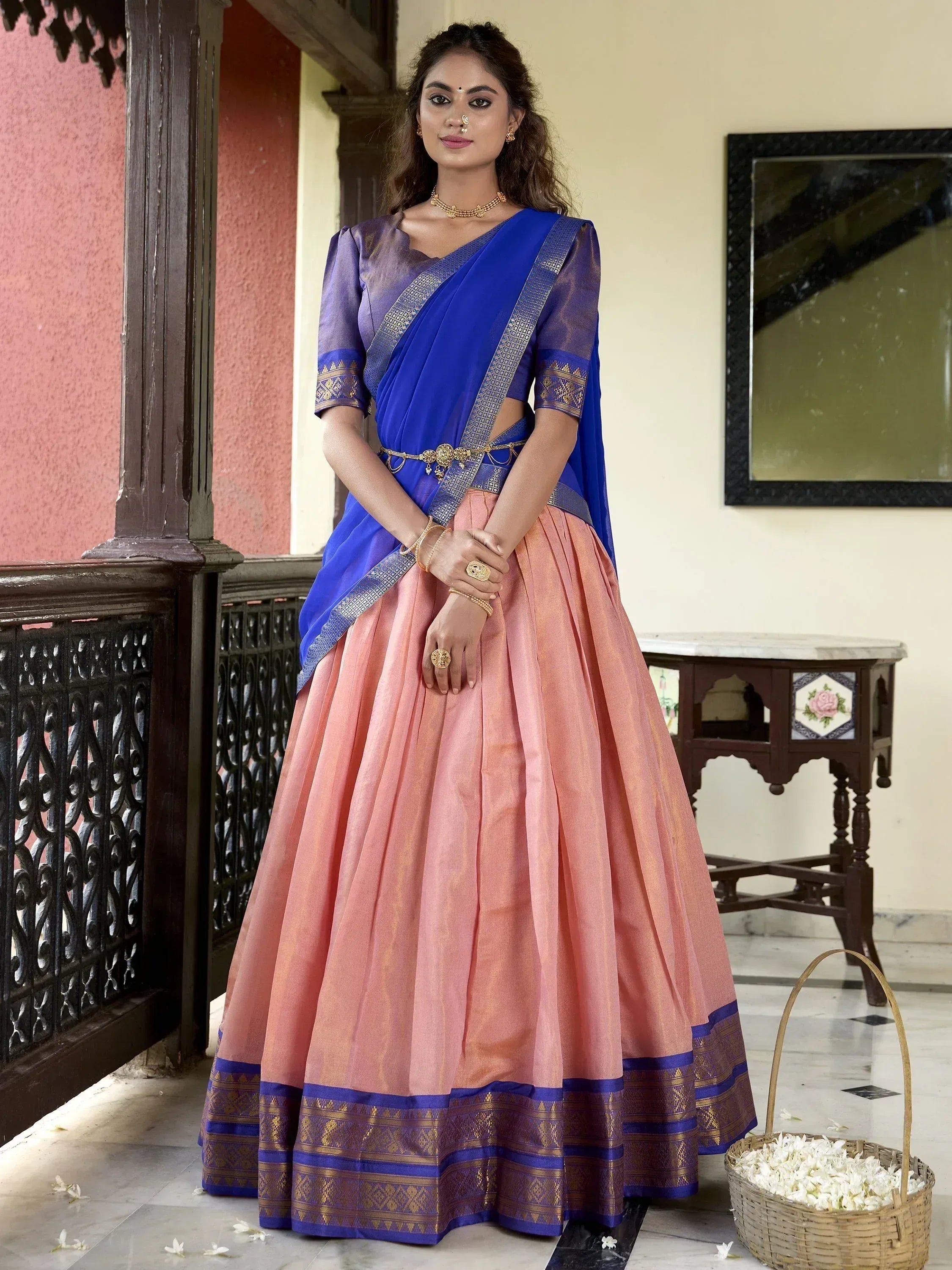 Blue and peach designer lehenga choli with gold embroidery, perfect for Indian ethnic wear occasions