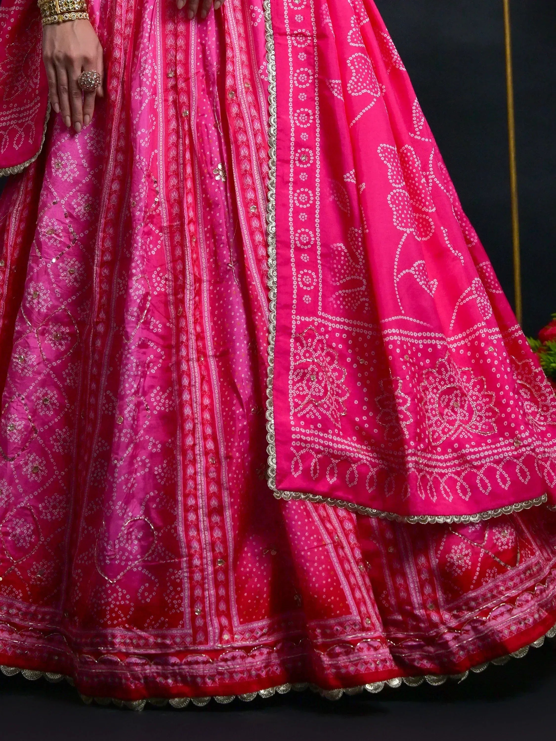 Pink designer lehenga choli with intricate white and gold embroidery, perfect for Indian ethnic wear occasions.