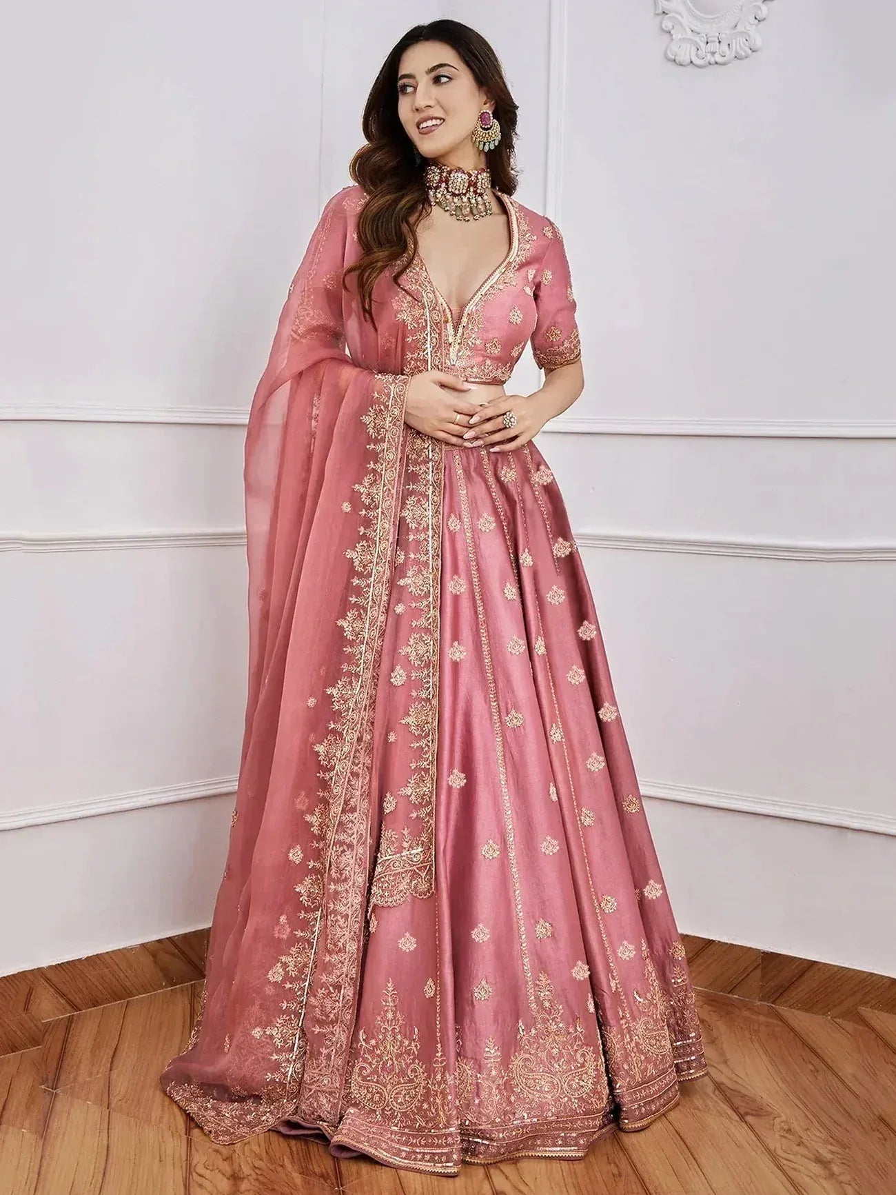 Pink embroidered lehenga choli with gold detailing, perfect for Indian ethnic wear and weddings