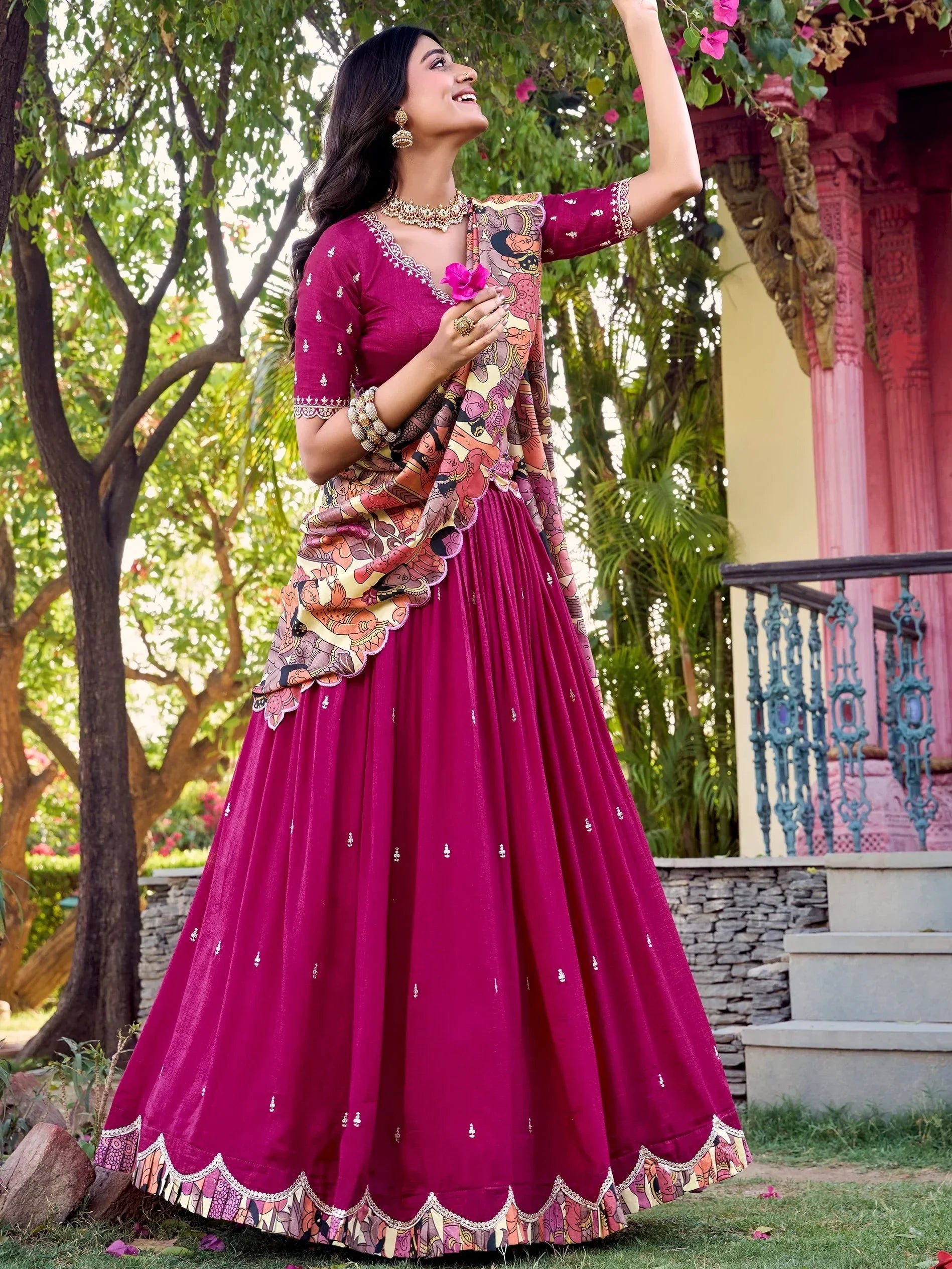 Woman in maroon designer lehenga choli with printed dupatta, perfect for Indian ethnic wear occasions