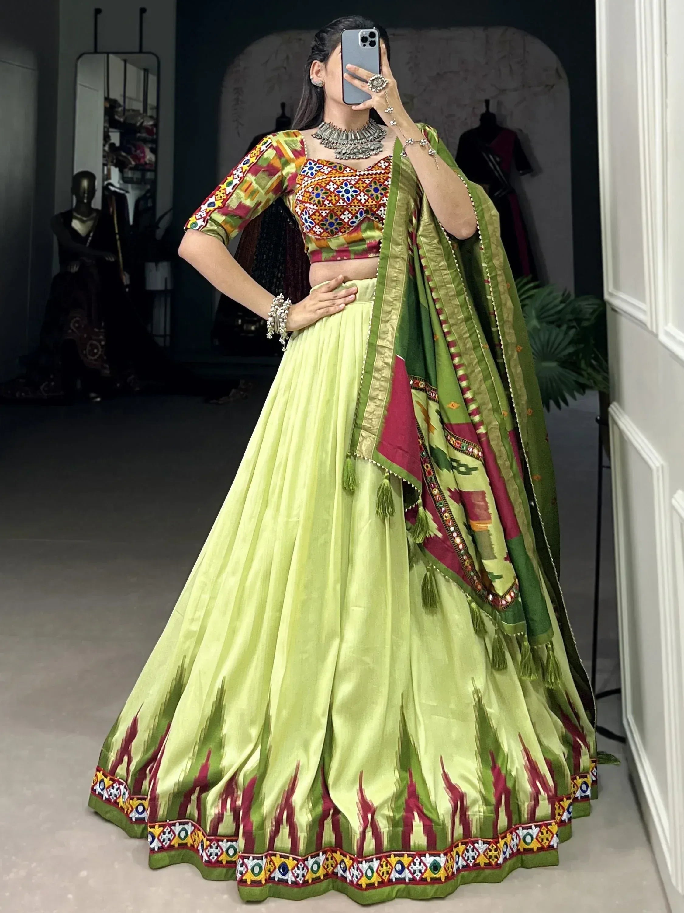 Vibrant green lehenga choli with colorful embroidery, perfect for Indian ethnic wear and festive occasions.