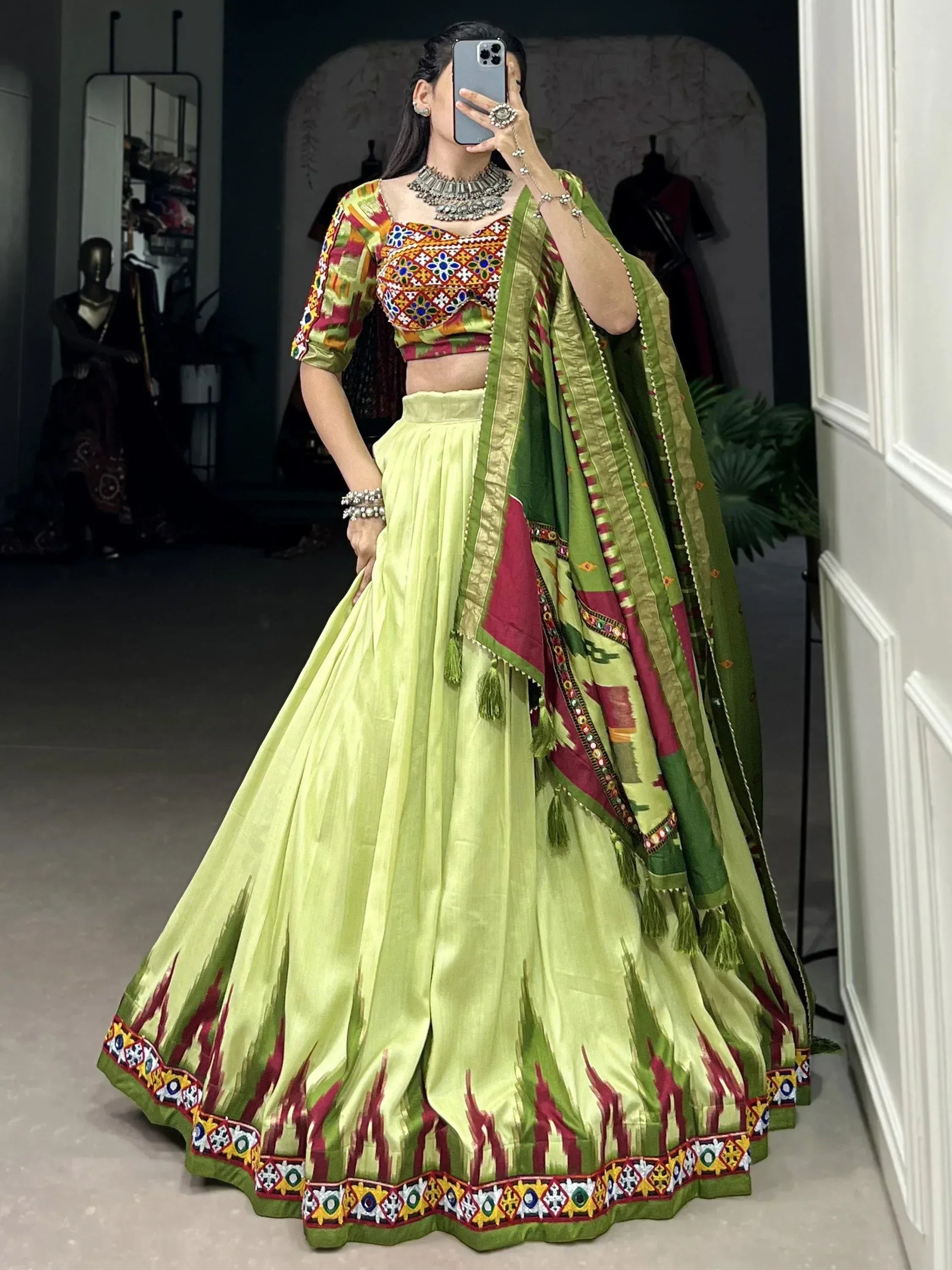 Vibrant green lehenga choli with colorful embroidery and dupatta, perfect for Indian ethnic wear occasions
