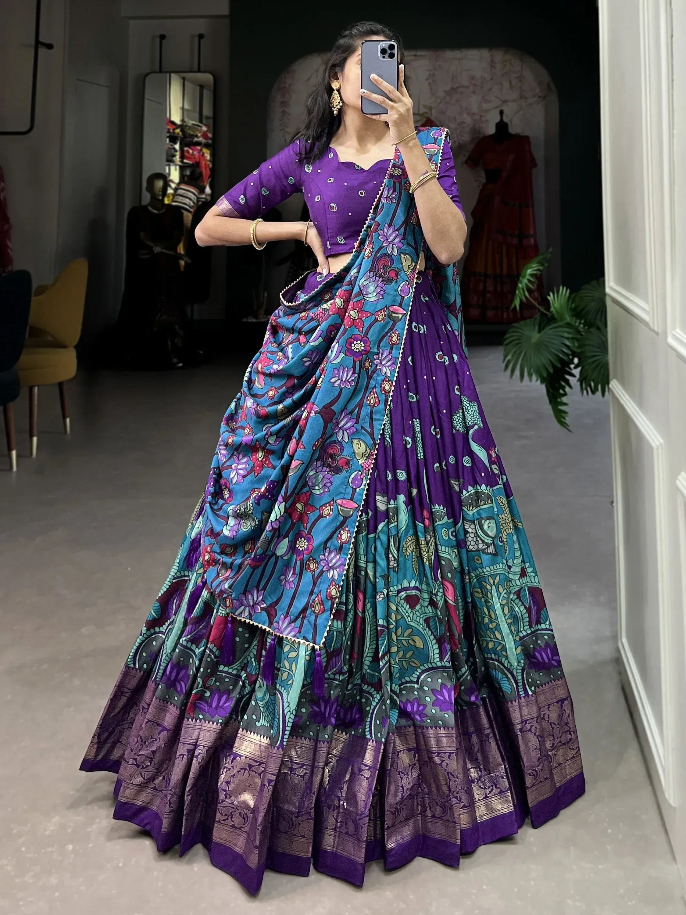 Purple and blue floral print lehenga choli with designer blouse and dupatta, perfect for Indian ethnic occasions.