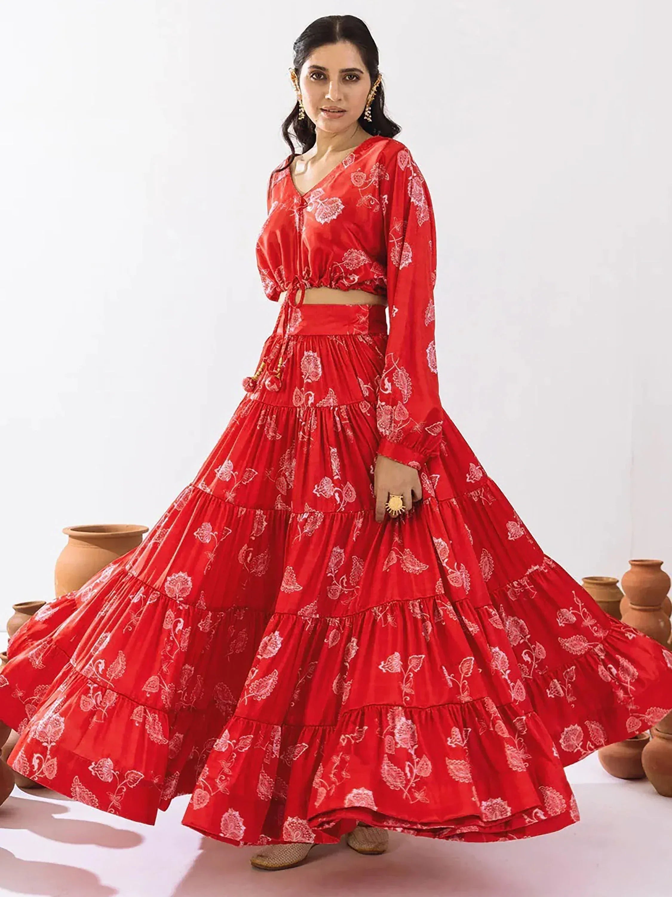 Red floral print lehenga choli with tiered skirt, perfect for Indian ethnic wear occasions