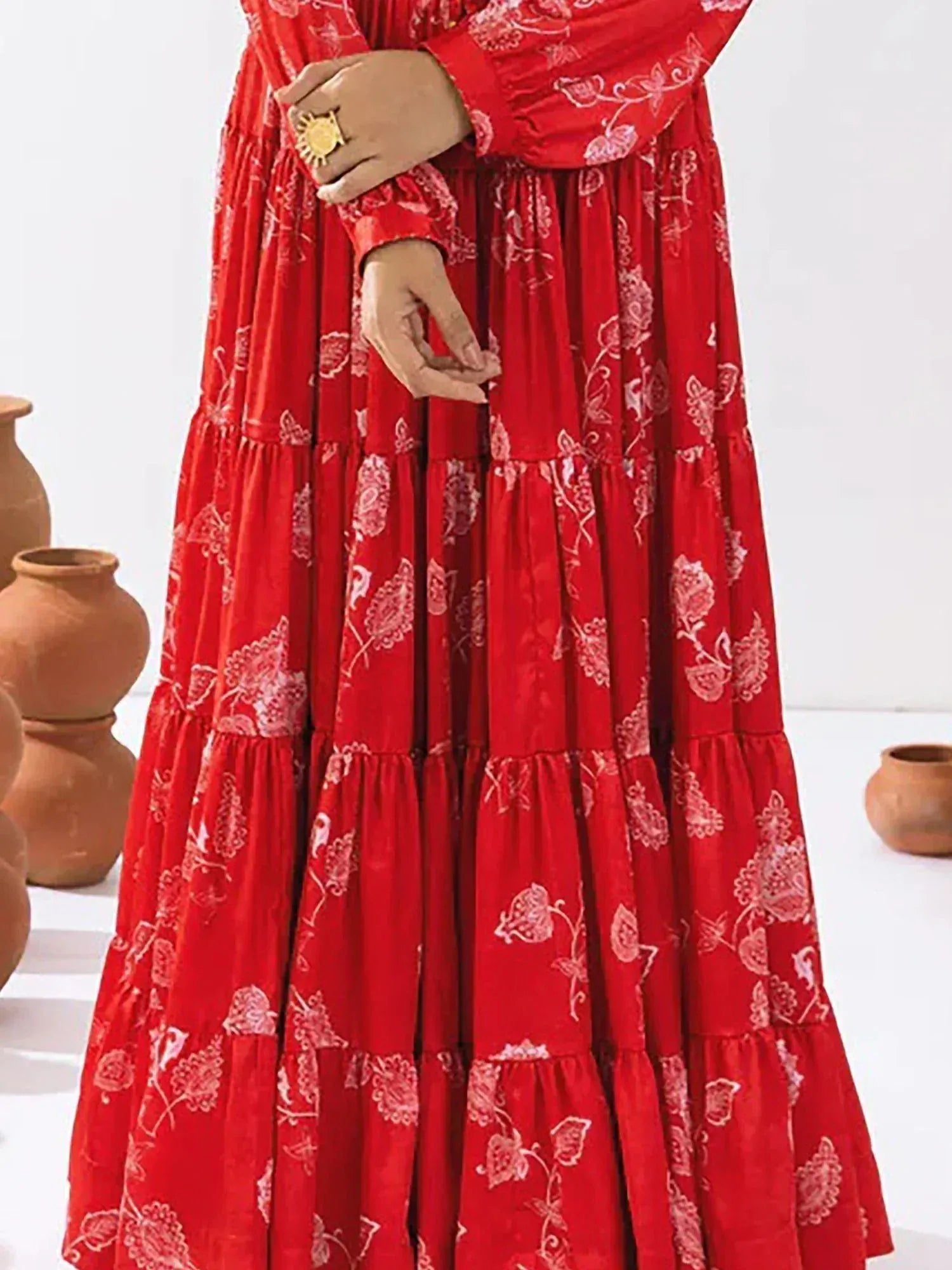 Red floral printed tiered ethnic gown with long sleeves, perfect for Indian festive occasions