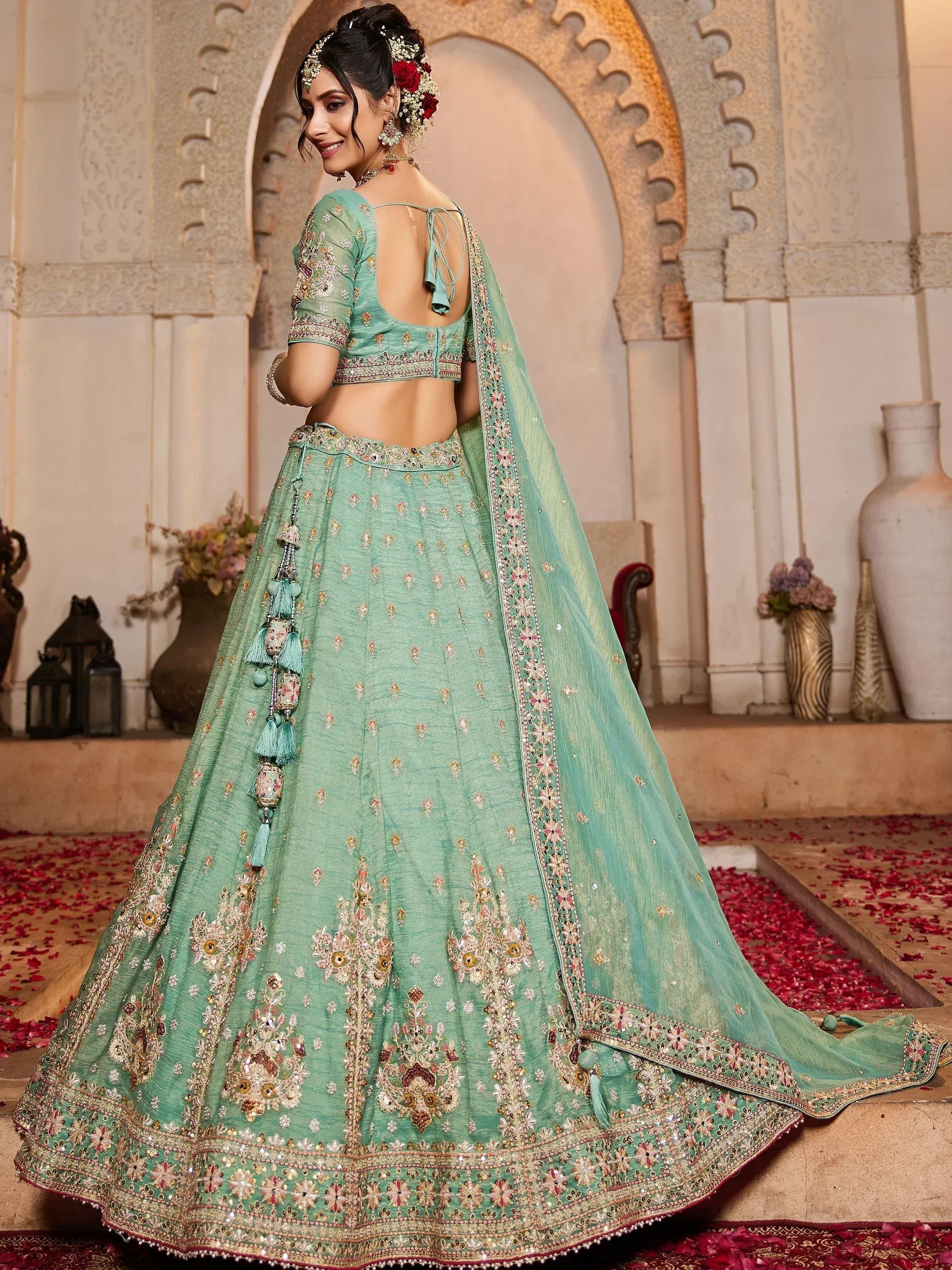 Mint green designer lehenga choli with heavy embroidery, perfect for weddings and festive occasions