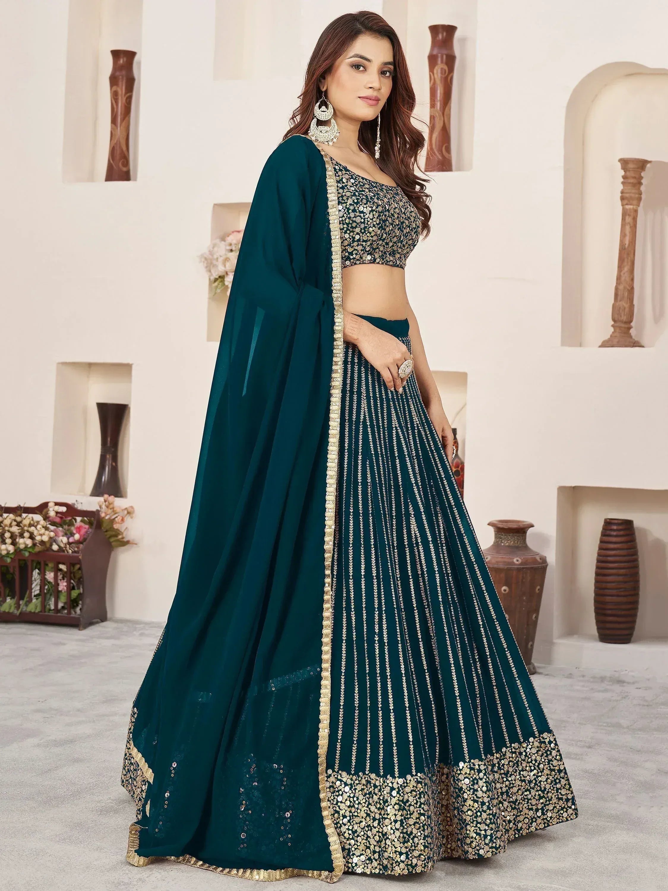 Emerald green designer lehenga choli with gold sequin work and sheer dupatta for Indian ethnic wear
