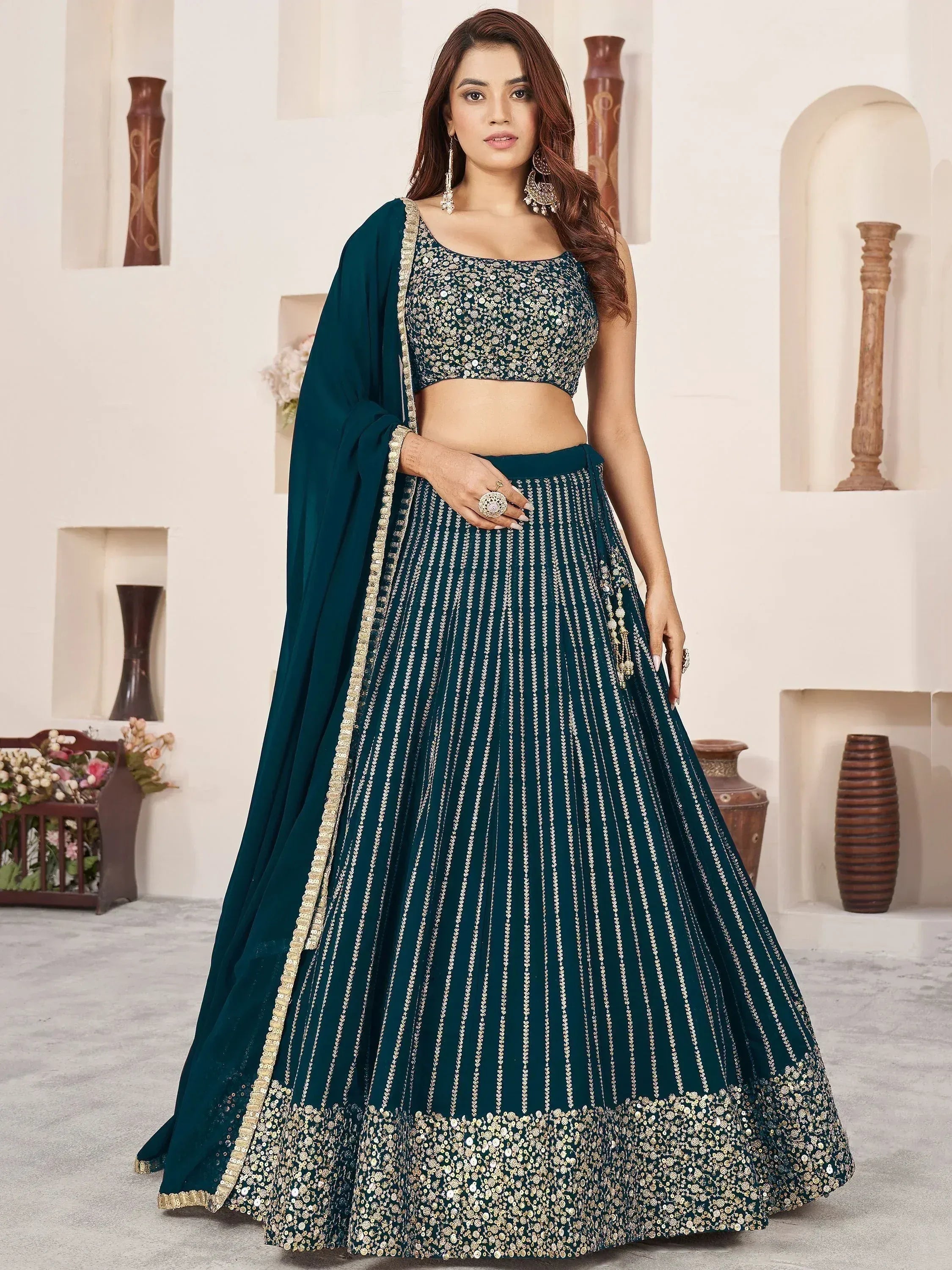 Emerald green designer lehenga choli with gold sequin work, perfect for Indian weddings and festive occasions